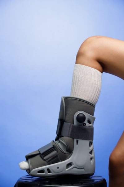 individual wearing ankle boot brace