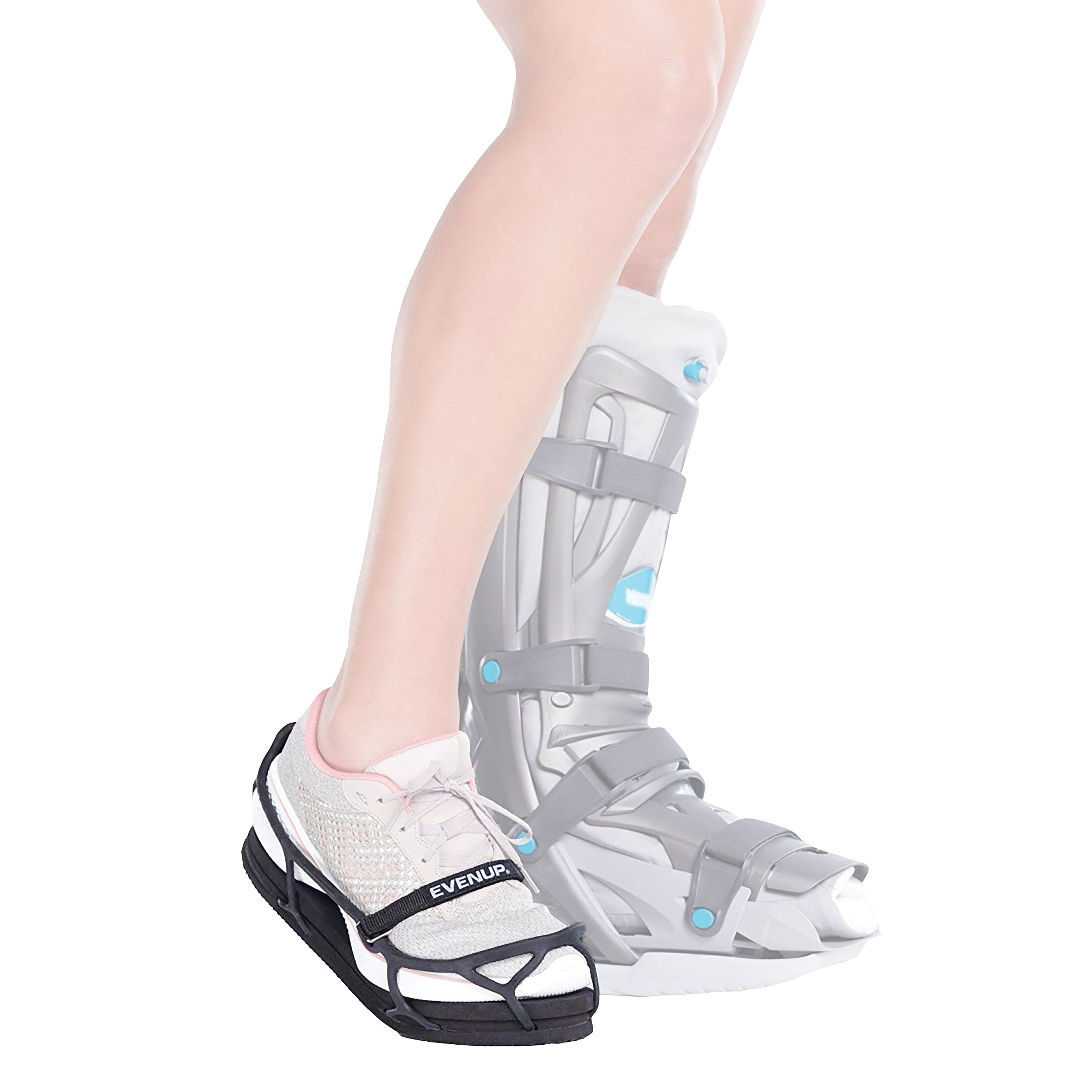 A person with a medical boot on their right leg wears an EVENup Orthotic Shoe Lift on their left shoe to equalize height.