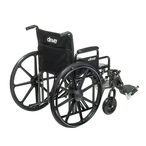 Drive Medical Sentra EC Heavy-Duty Wheelchair with removable desk arms, elevating leg rests, and large rear wheels shown.
