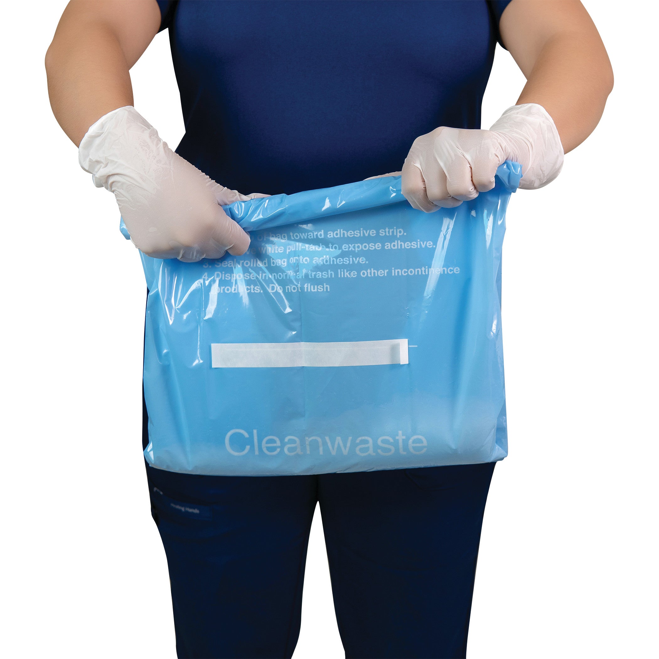 A person wearing gloves holds a blue "THE SANI-BAG+ Commode Liner" with instructions printed on it.
