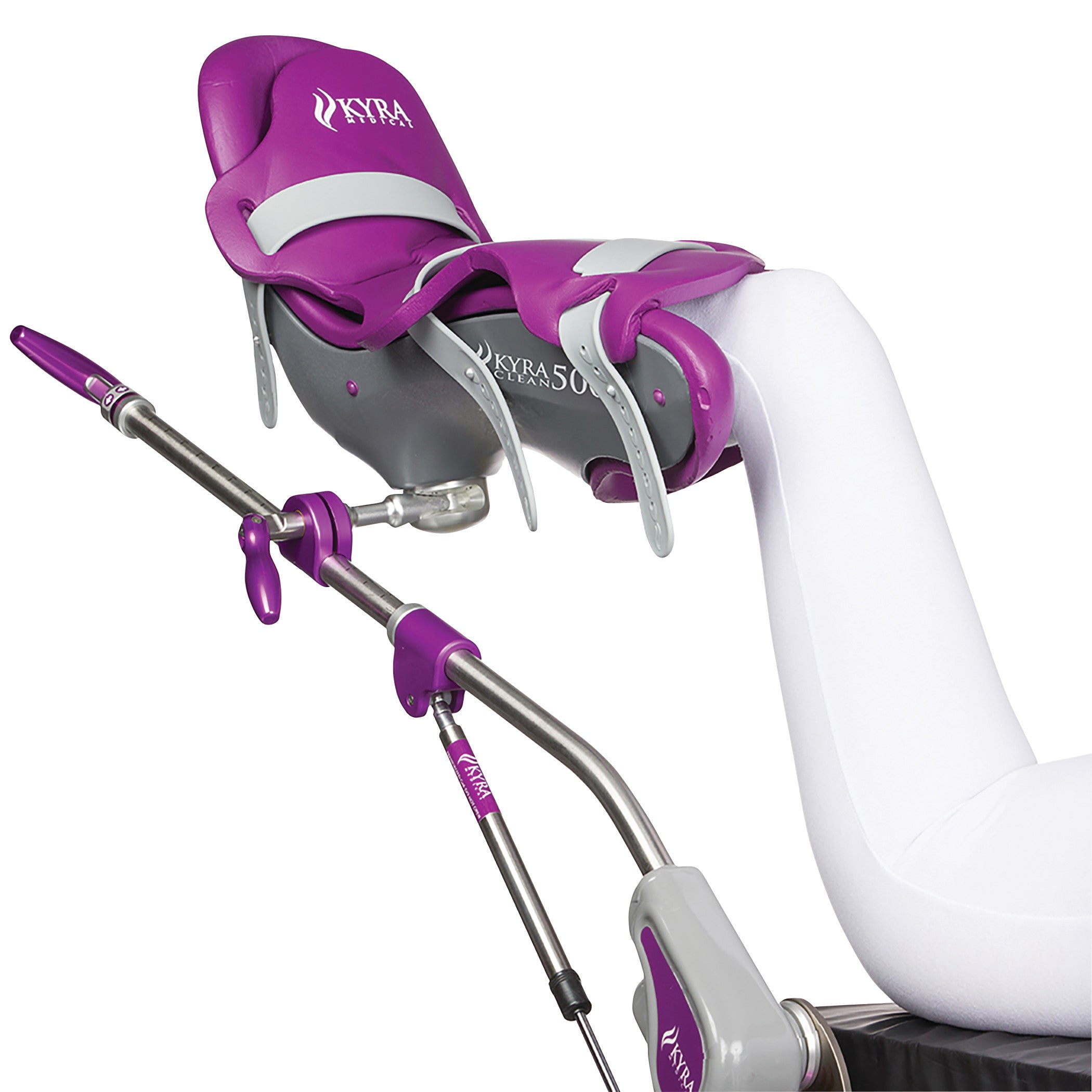 A white leg is secured in a KYRA Clean 500 Lithotomy Stirrup, featuring a purple and gray design with adjustable metal support.