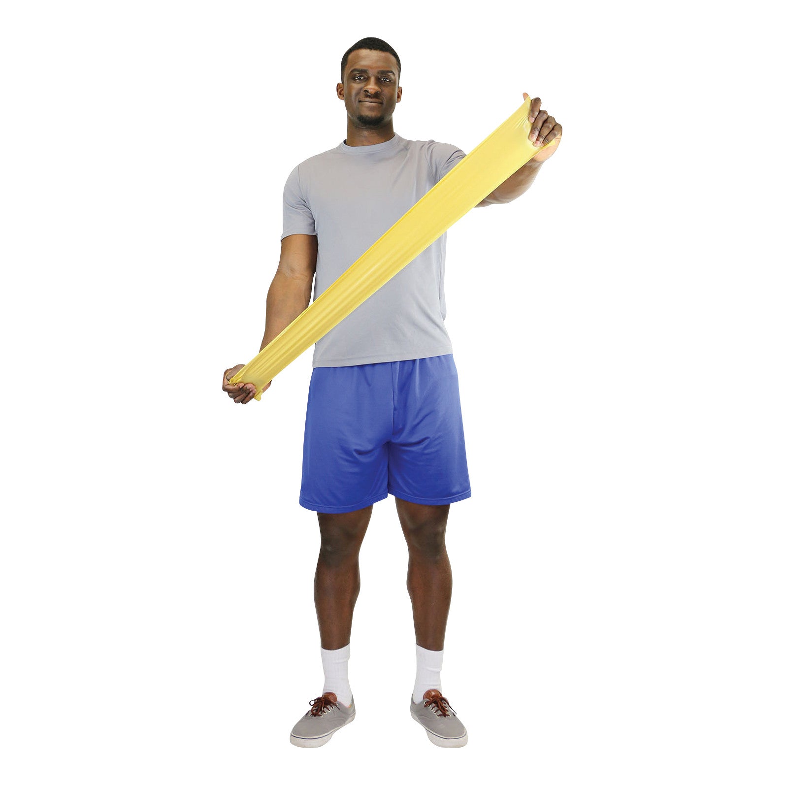 A person holds a yellow CanDo Sup-R Band Non-Latex Exercise Band, stretching it sideways, wearing a gray shirt and blue shorts.
