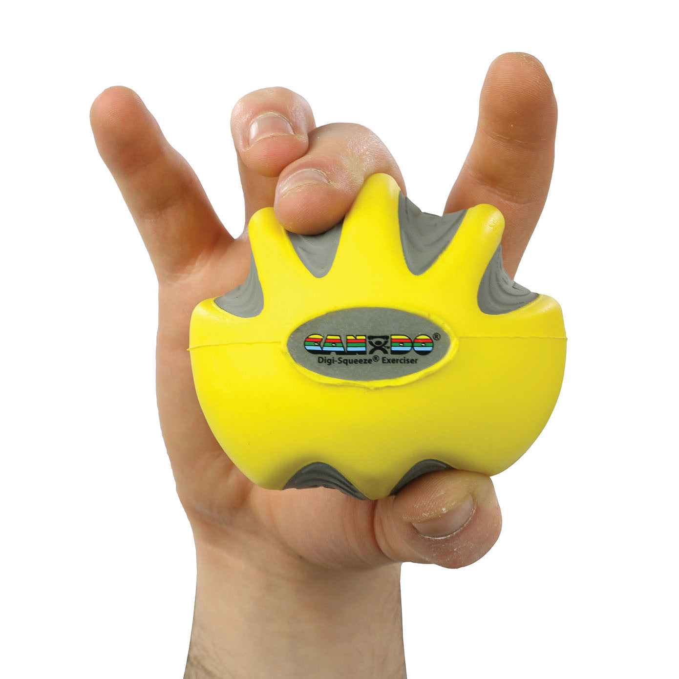 A hand squeezes a yellow CanDo Digi-Squeeze Hand Exerciser with gray grips, displaying its ergonomic design and logo.