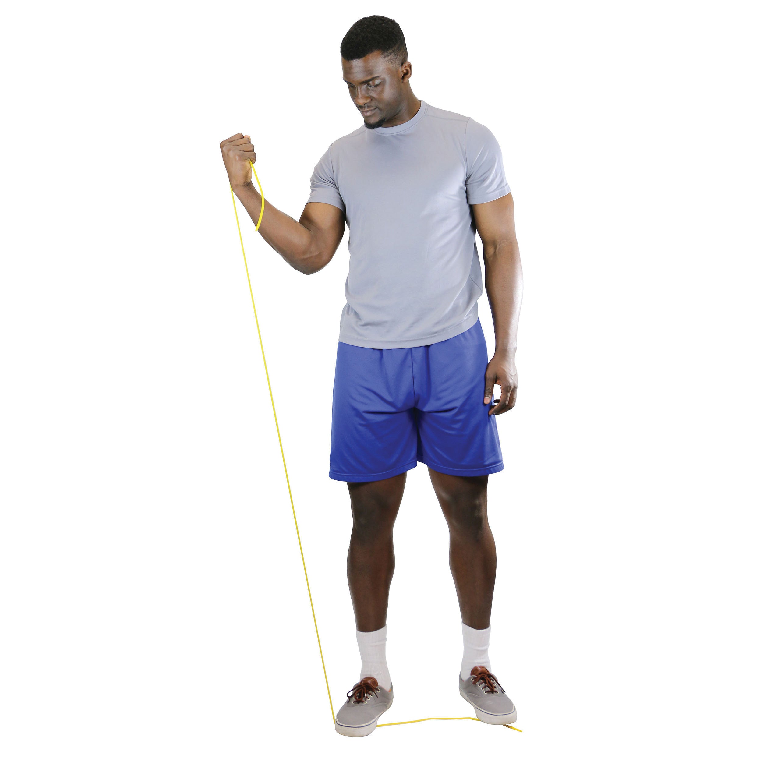 A person exercises with yellow CanDo Exercise Tubing, wearing a gray shirt and blue shorts. The tubing is under one foot.
