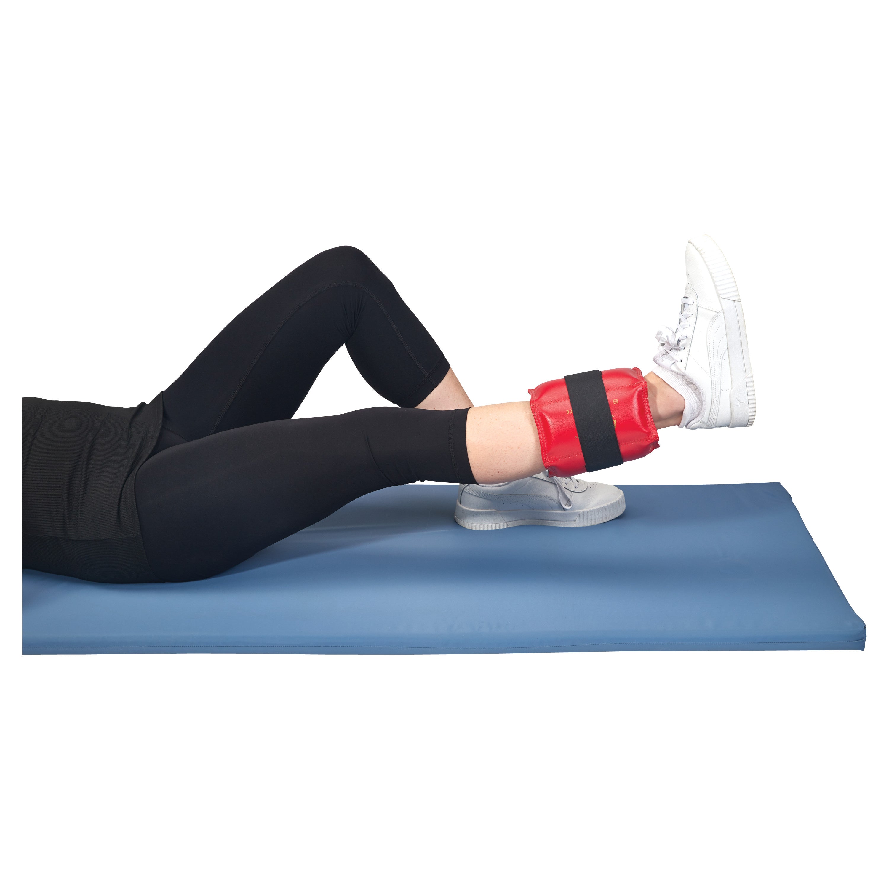 Person using an AliMed Color-Coded Cuff Weight in red on their ankle while lying on a blue exercise mat.