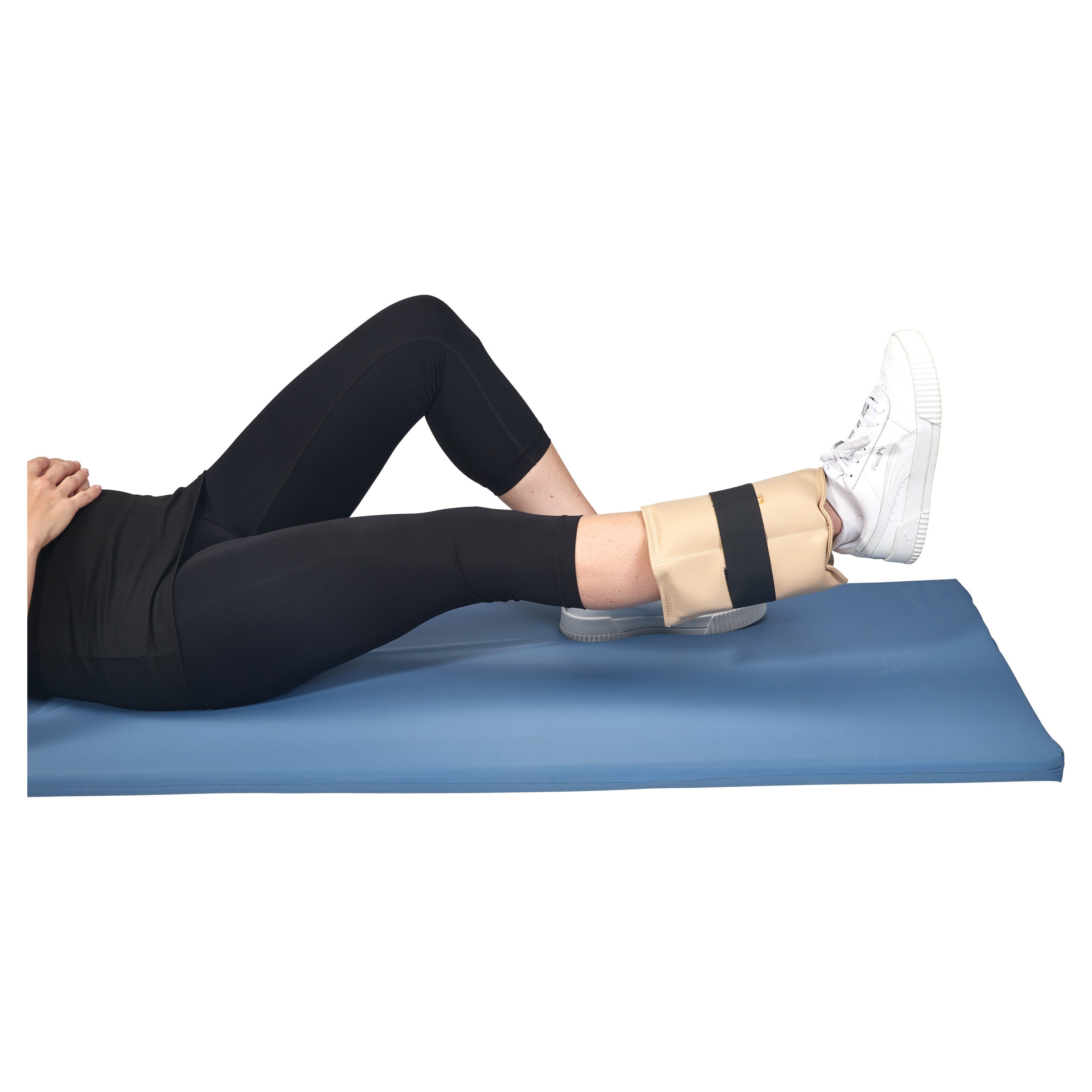 Person lying on a blue mat, wearing an AliMed Color-Coded Cuff Weight on their ankle, with one leg bent and one extended.
