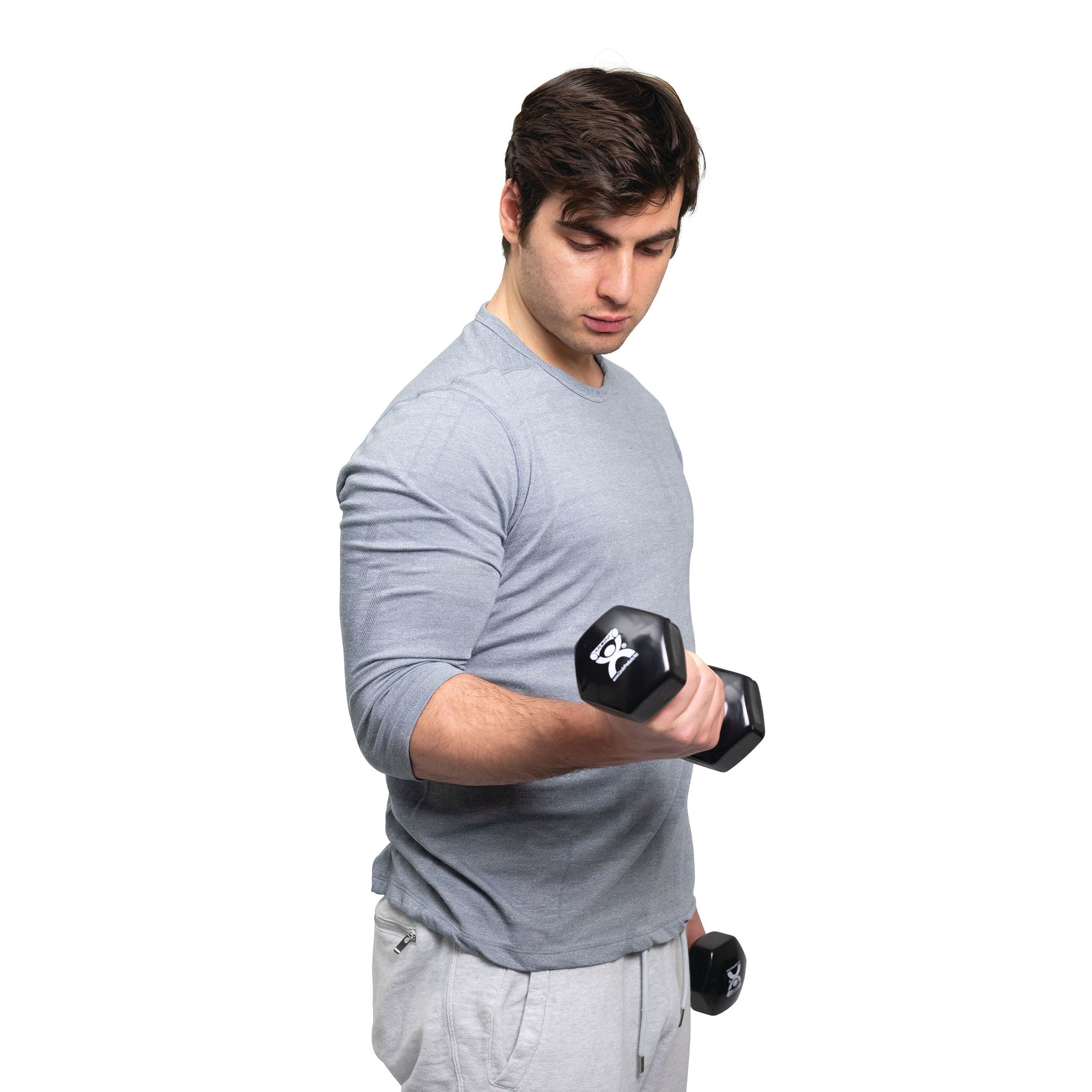 A person in a grey shirt lifts a CanDo Vinyl-Coated Dumbbell. They're holding two black dumbbells, looking down.