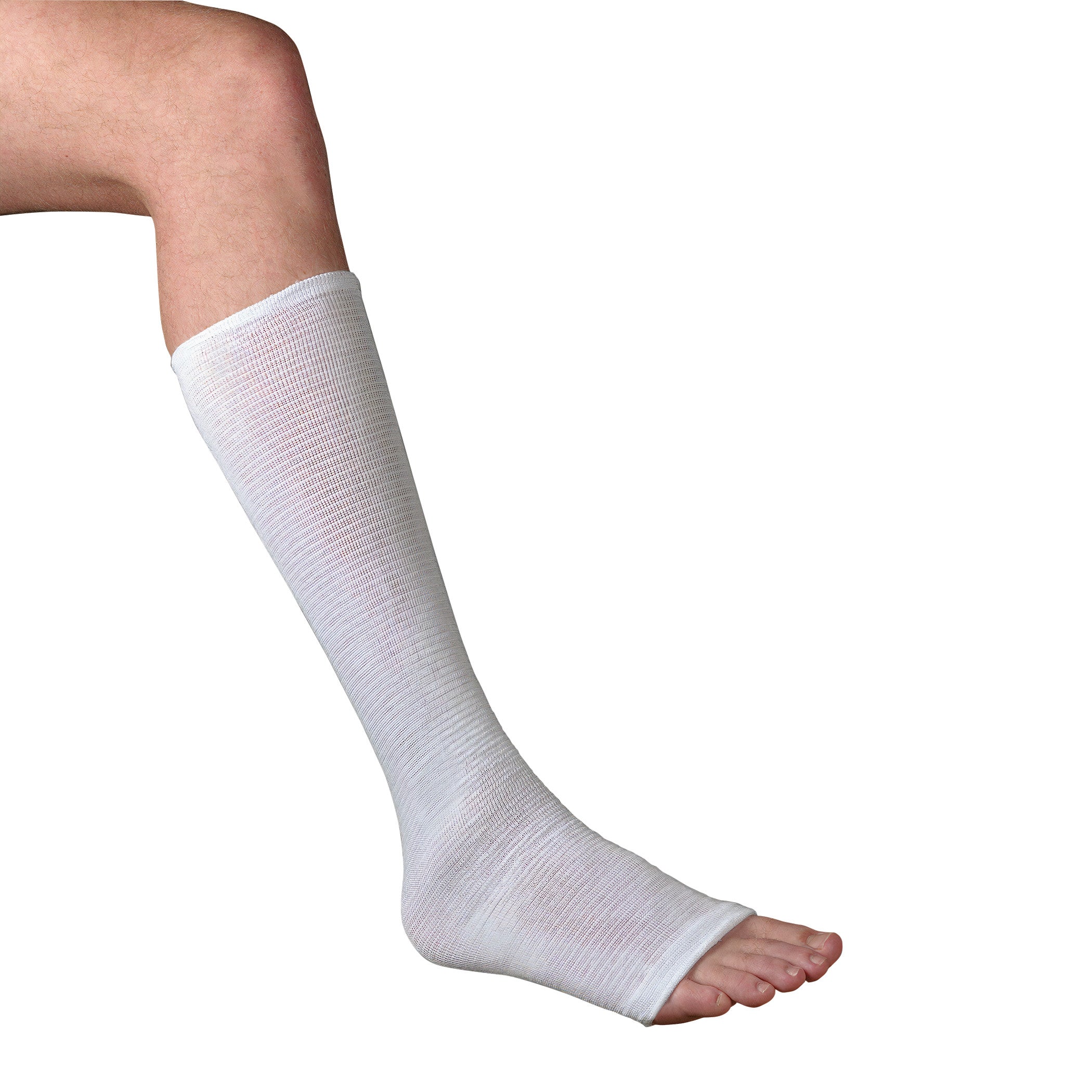 A leg wearing a Compressogrip Tubular Elastic Bandage, covering from below the knee to the foot, leaving the toes exposed.