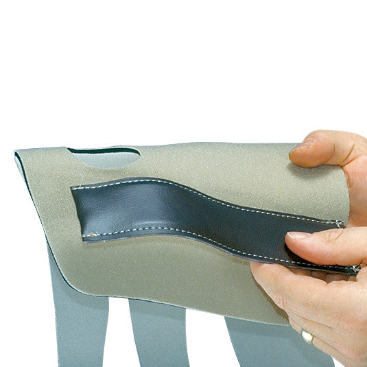 A hand holds the AliMed Conventional Neoprene Universal Wrist Support, showing its flexible material and stitched detailing.