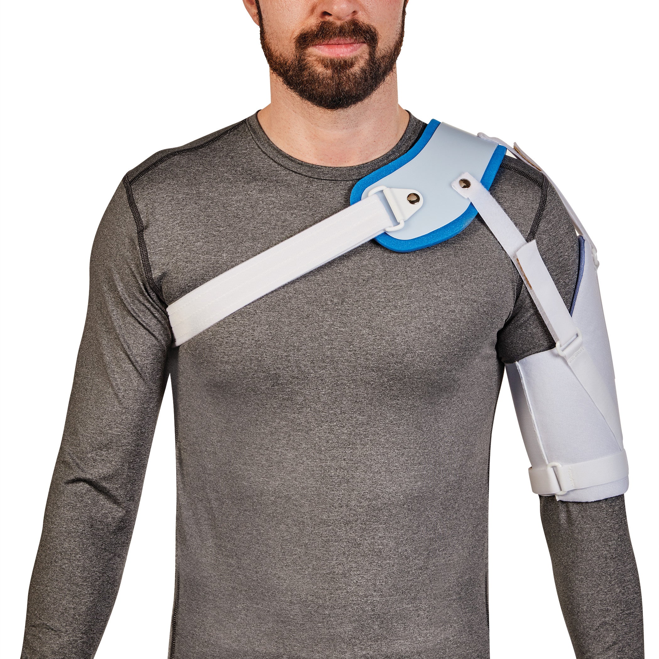 A person wearing the AliMed Hemi-Shoulder Sling, featuring a gray compression shirt beneath, with a white and blue support strap.
