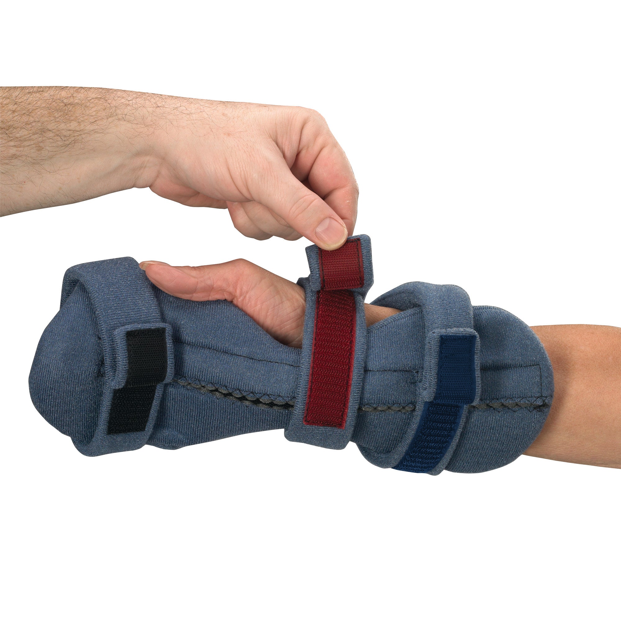 A hand is adjusting the OCSI SoftPro Palmar Resting WHFO, a blue orthopedic support with red and black straps, on an arm.