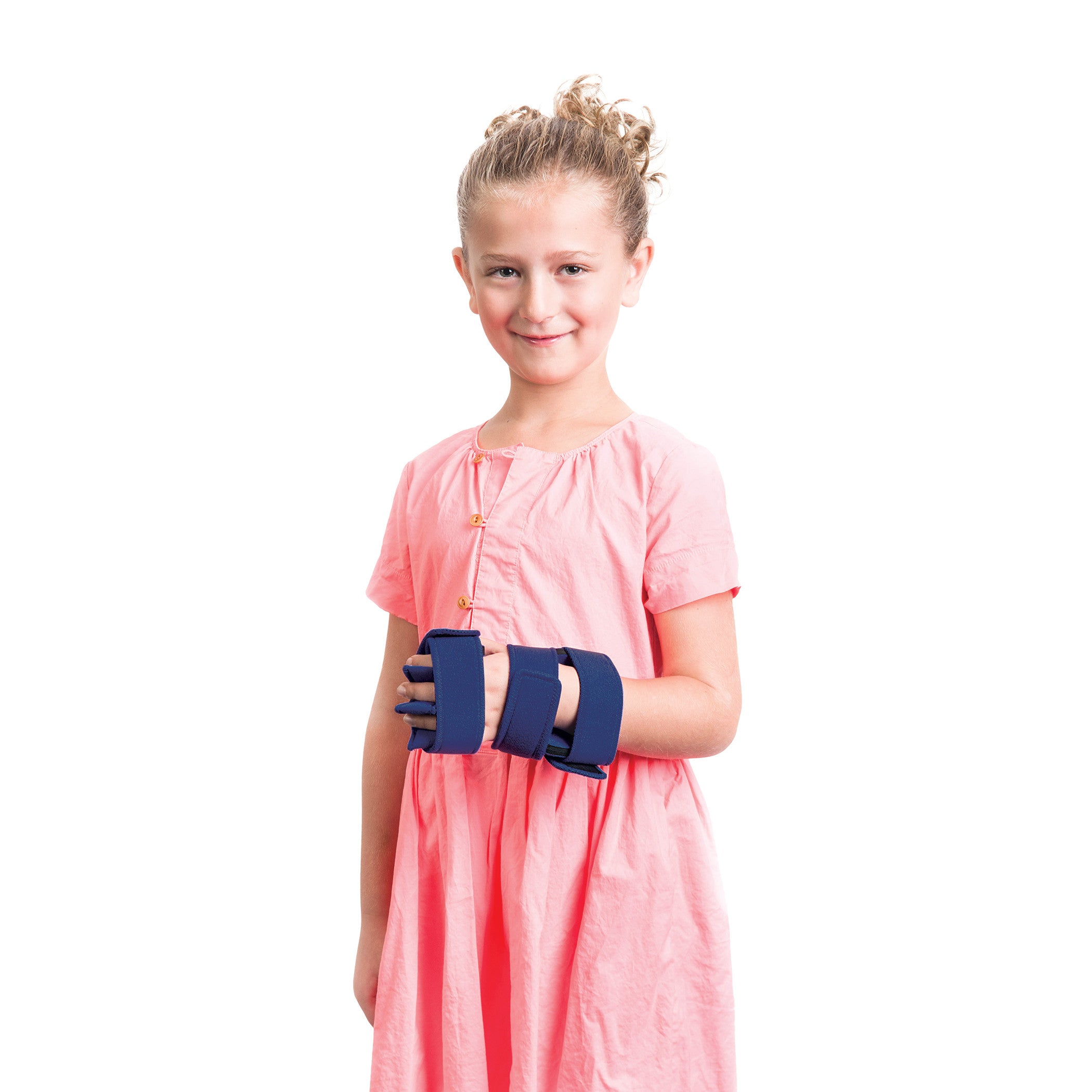 A young girl wears the Comfy Splints Pediatric Hand/Wrist Separate Finger Orthosis, featuring blue straps, over a pink dress.