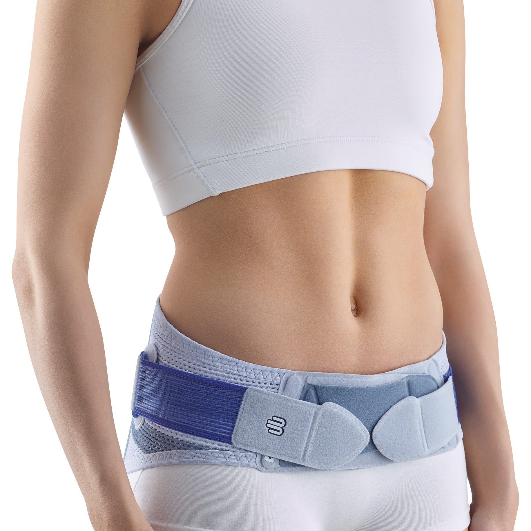 A person wears a Bauerfeind SacroLoc support belt, designed to provide stability around the lower back and hip area.