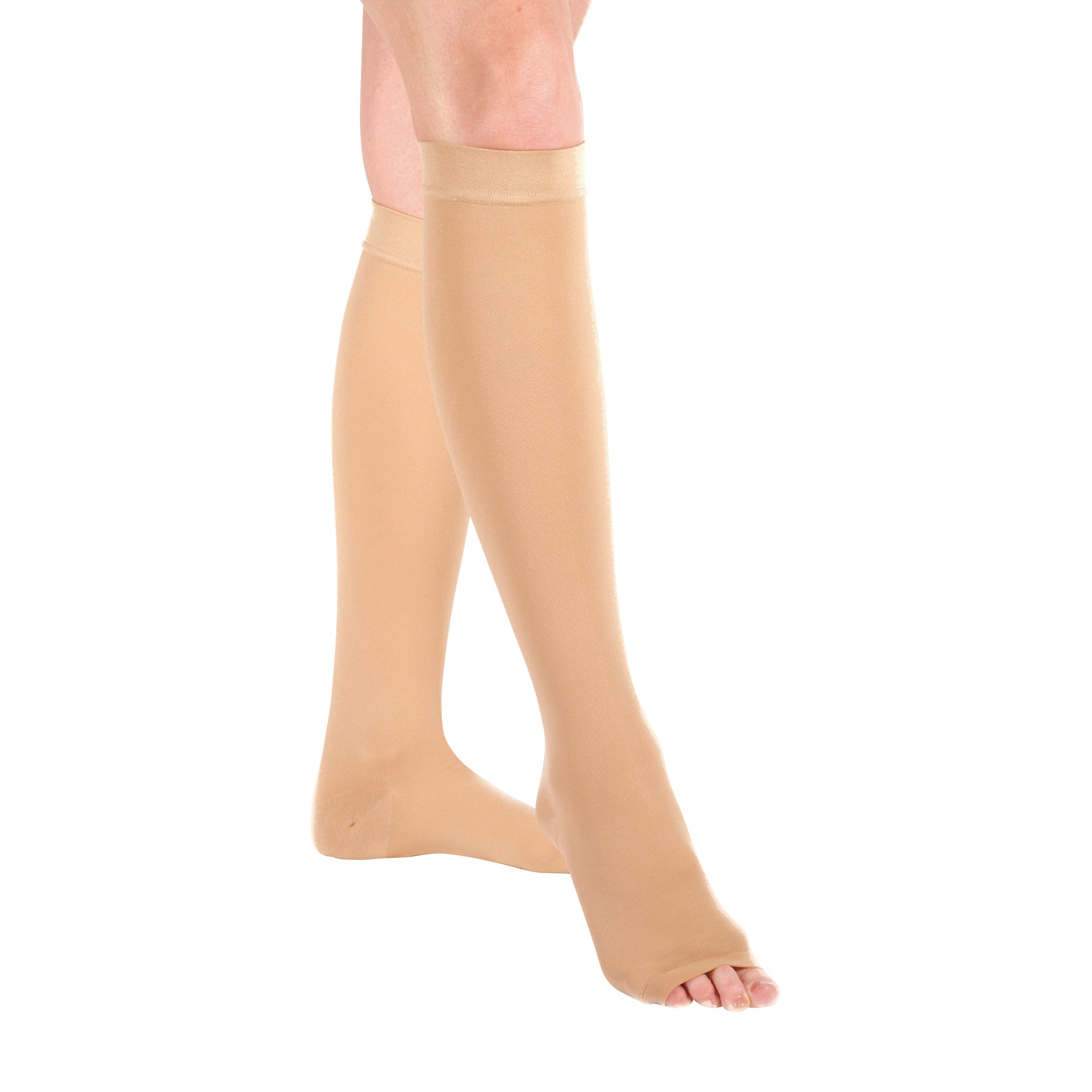 A person wearing beige Ames Walker Open Toe Knee-Length Medical Support Stockings on a white background, showing legs and feet.