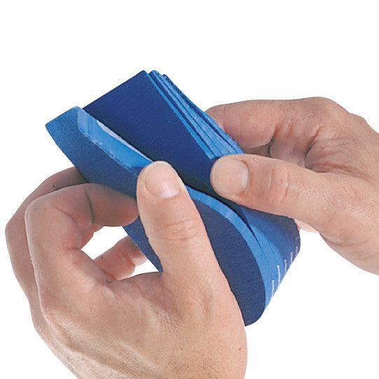 A person holding a blue Replacement Tri-Level Insole for the AliMed Achilles Tendon Walker, showing its layered design.