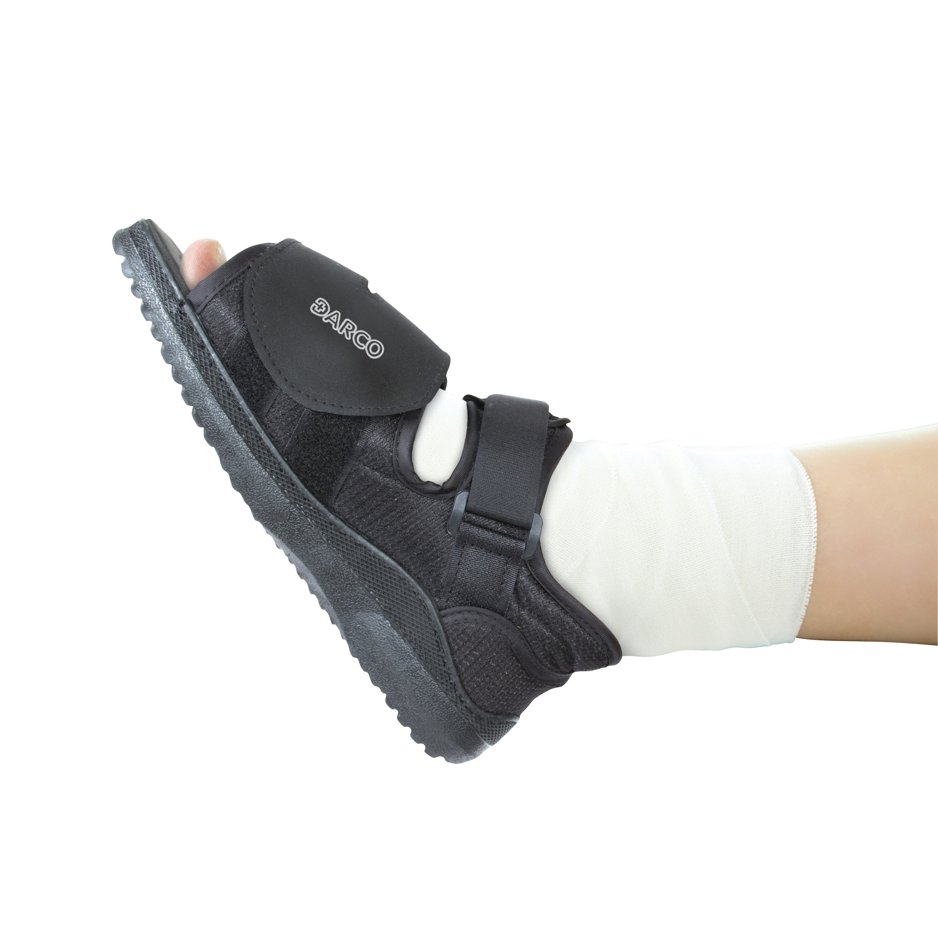 A DARCO MedSurg Shoe on a foot with a bandage, featuring a black open-toe design and adjustable straps for support.