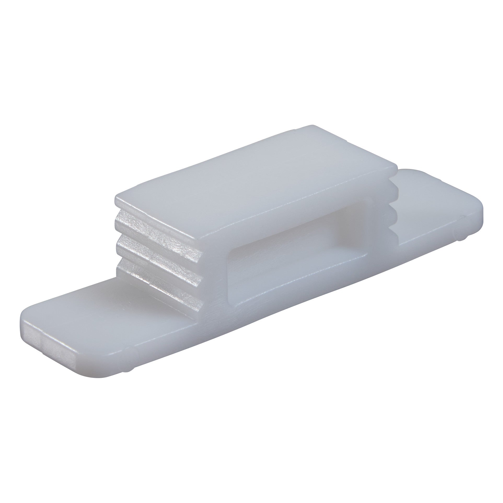 A white Replacement Wedge for CastWedge Starter Set, featuring a rectangular shape with grooved sides and a flat base.