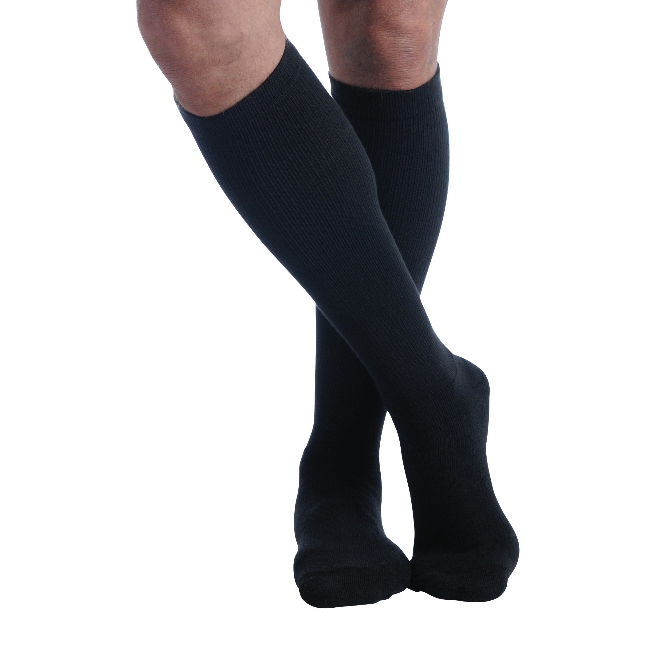 Person wearing Ames Walker Knee-Length Microfiber Support Socks in black, with legs crossed against a white background.