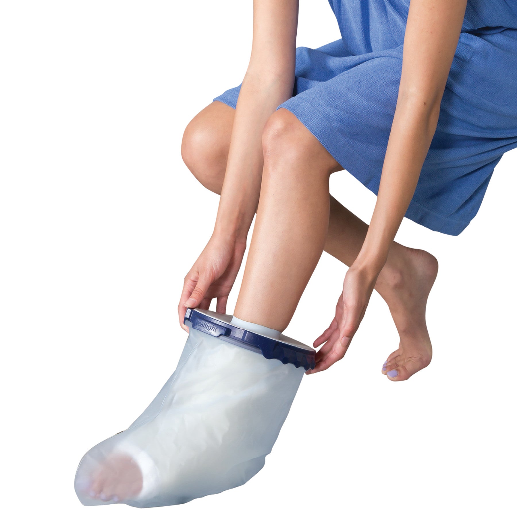 Person using the Brownmed SEAL-TIGHT Infinity Cast Protector to cover a foot. It's a waterproof, clear covering with a blue seal.