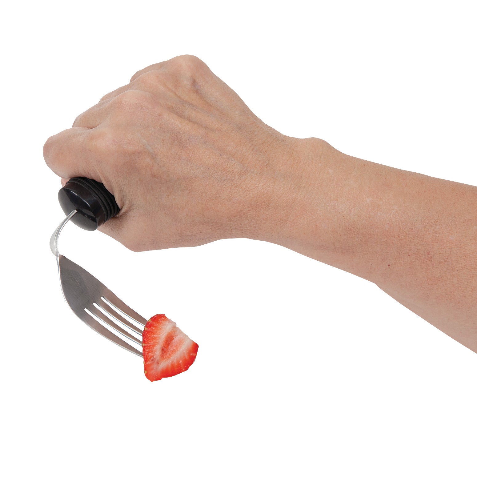 A hand holds a Good Grips Weighted Utensil fork with a black handle, spearing a slice of strawberry.