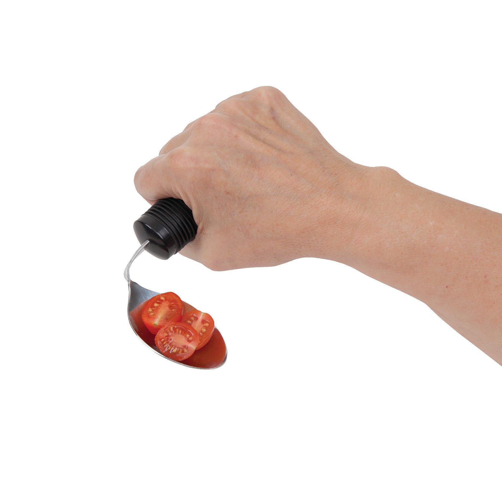 A hand holding a "Good Grips Weighted Utensil" spoon with sliced cherry tomatoes on it, showcasing its ergonomic handle.
