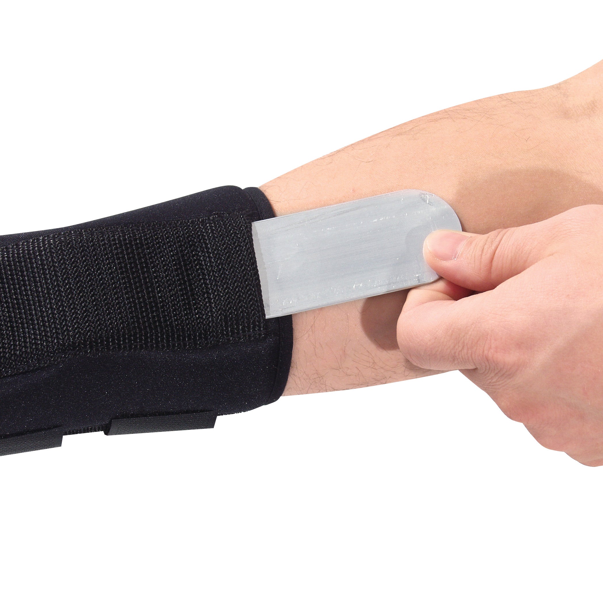A person inserts a metal stay into an AliMed FREEDOM comfort Thumb Spica wrist brace, enhancing support and stability.
