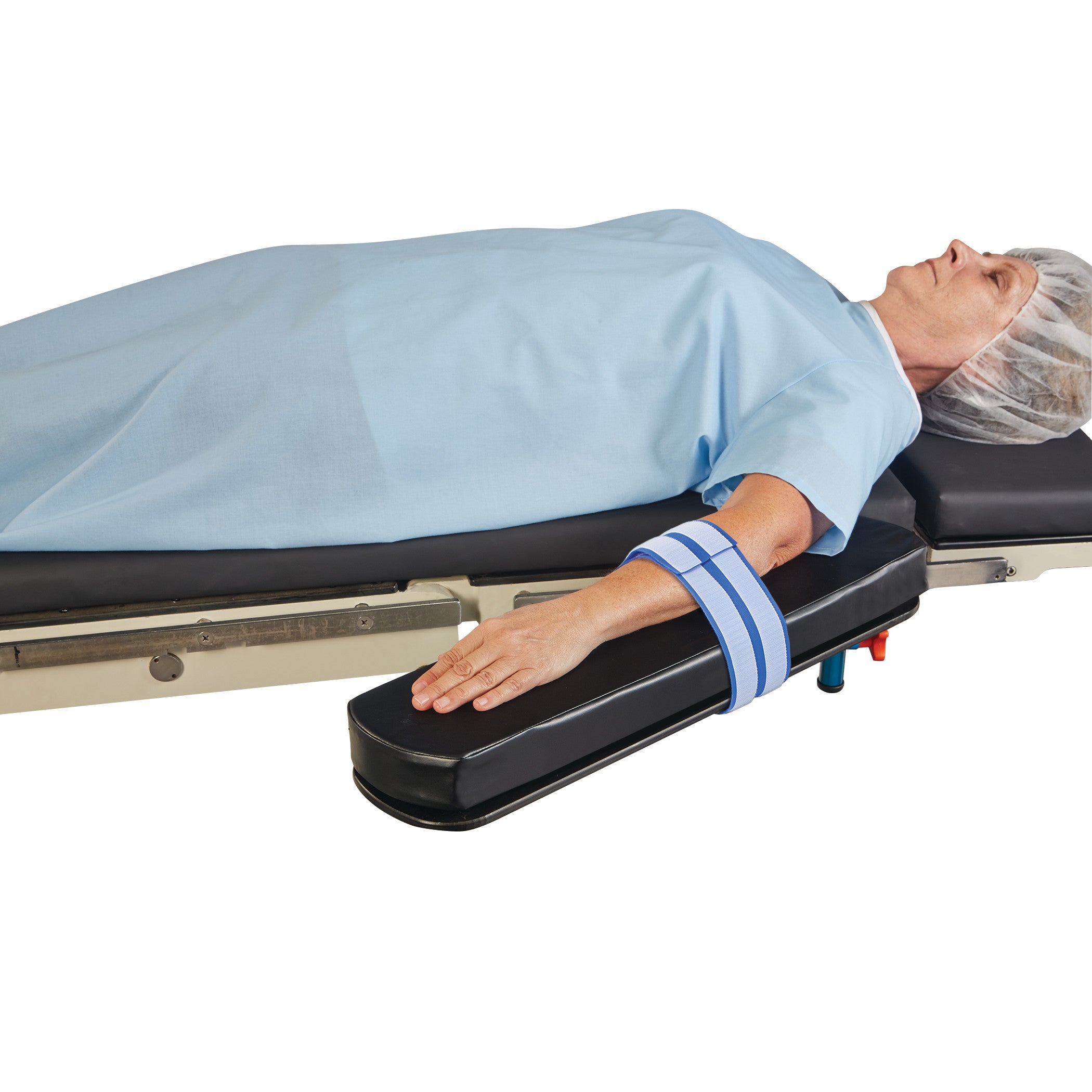 A patient lies on a hospital bed with an AliMed AliStrap Precut Patient Safety Strap securing the arm on an extended pad.