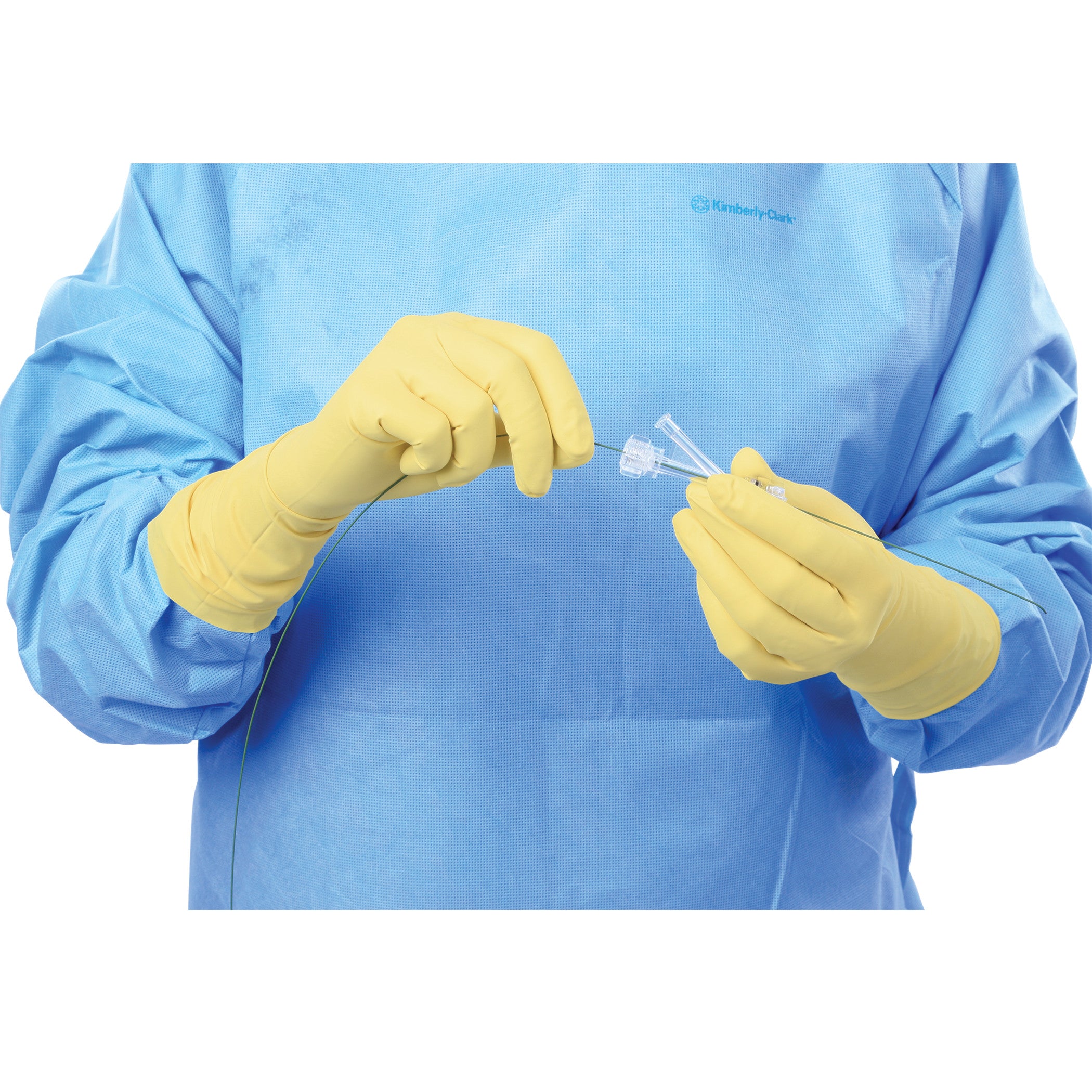 Person wearing AliMed Original Radiation Attenuation Gloves and a blue gown, holding a medical instrument.