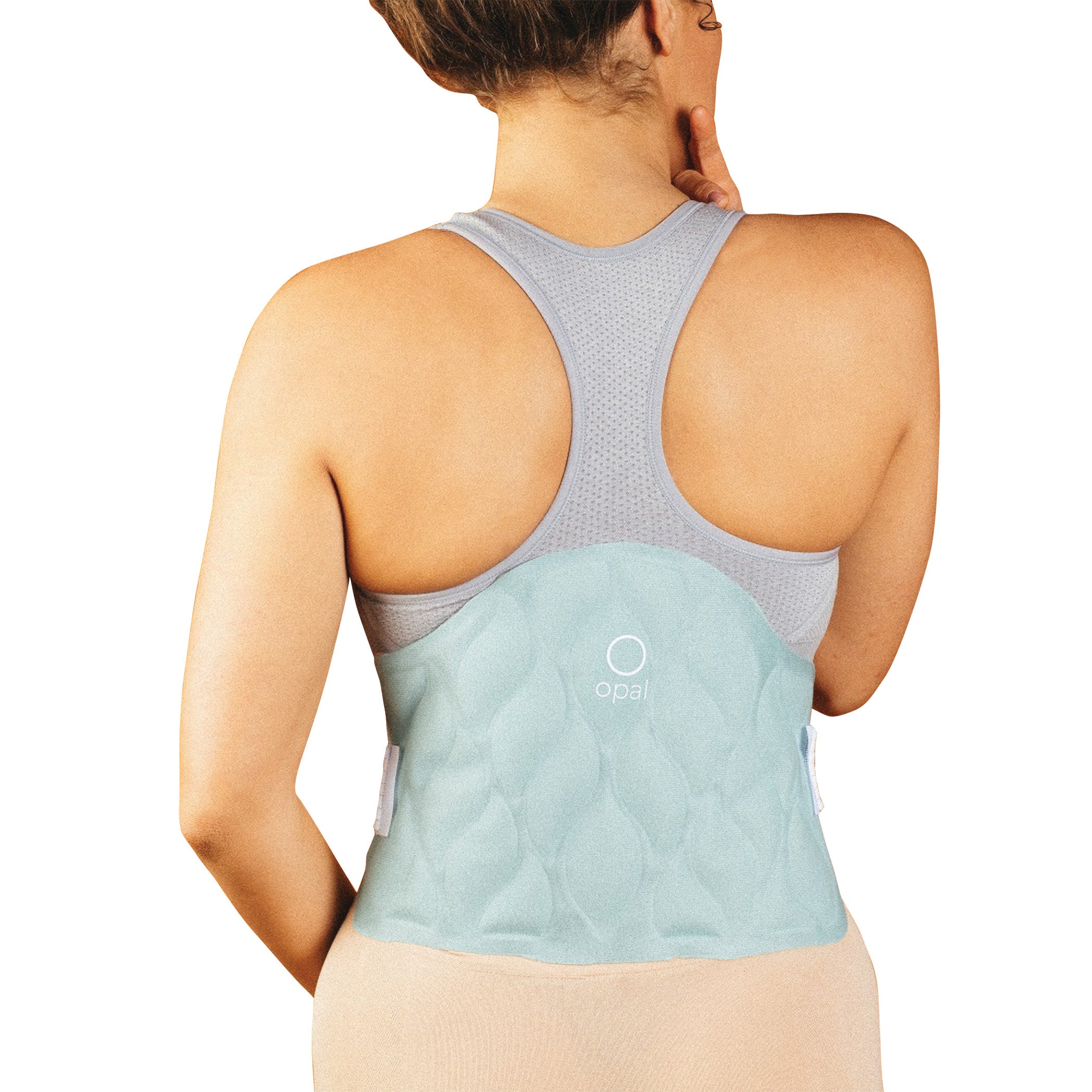 A person wears the Xena Therapies Opal Cool One, a light blue cooling pad on their lower back, under a gray tank top.
