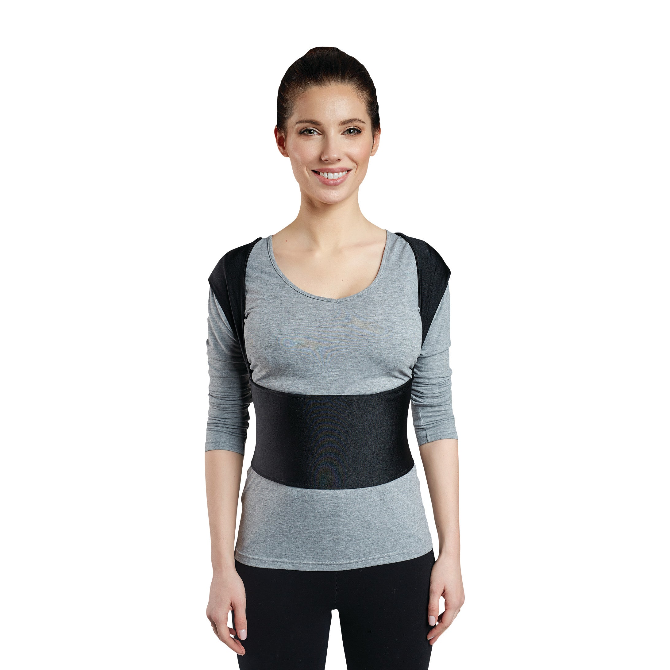 Woman wearing a Femi Posture support vest, smiling. The vest is black with shoulder and waist straps, over a gray top.