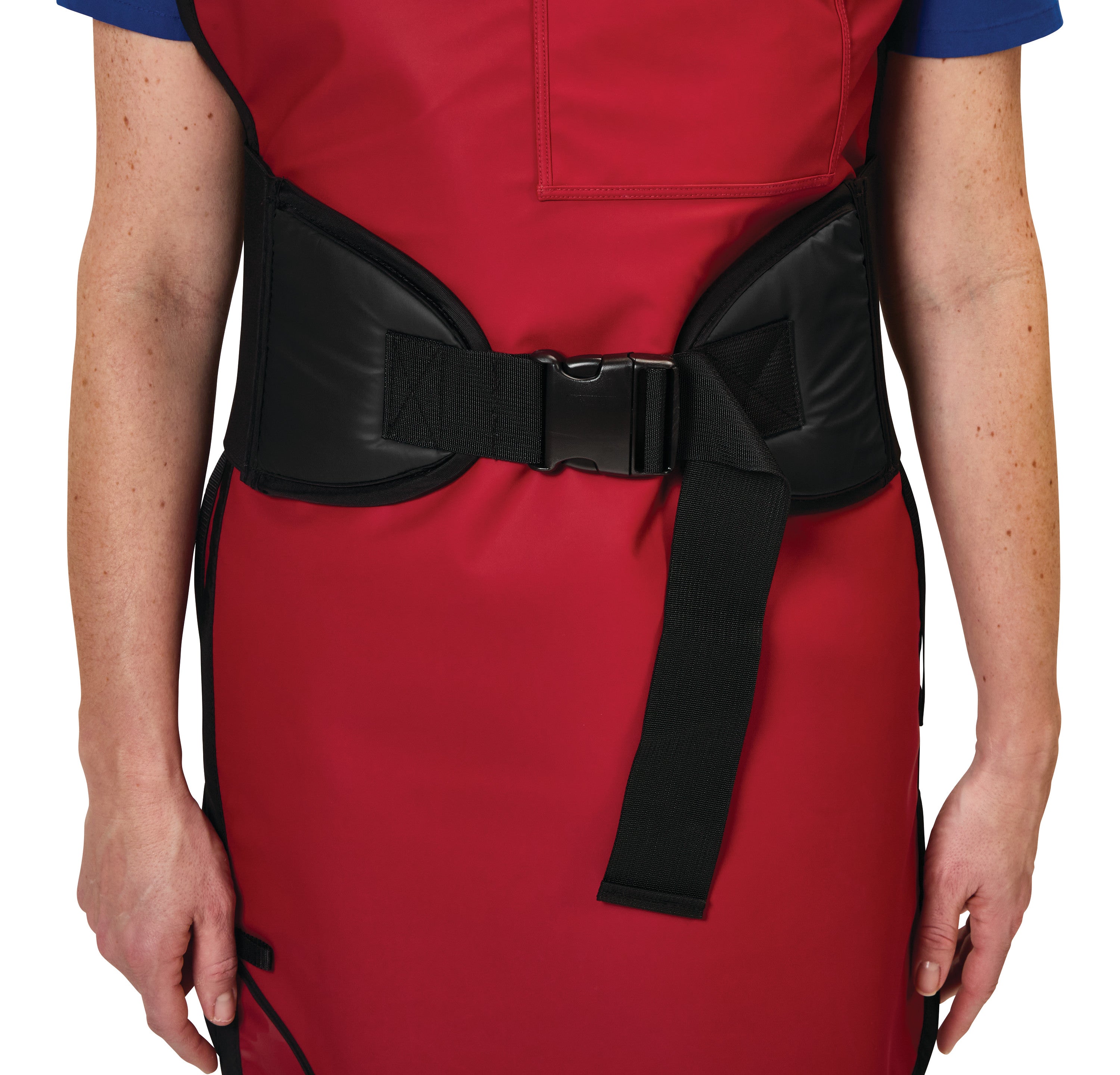A person wearing a red apron with an AliMed Back Saver Belt, featuring a black buckle and strap, around the waist.