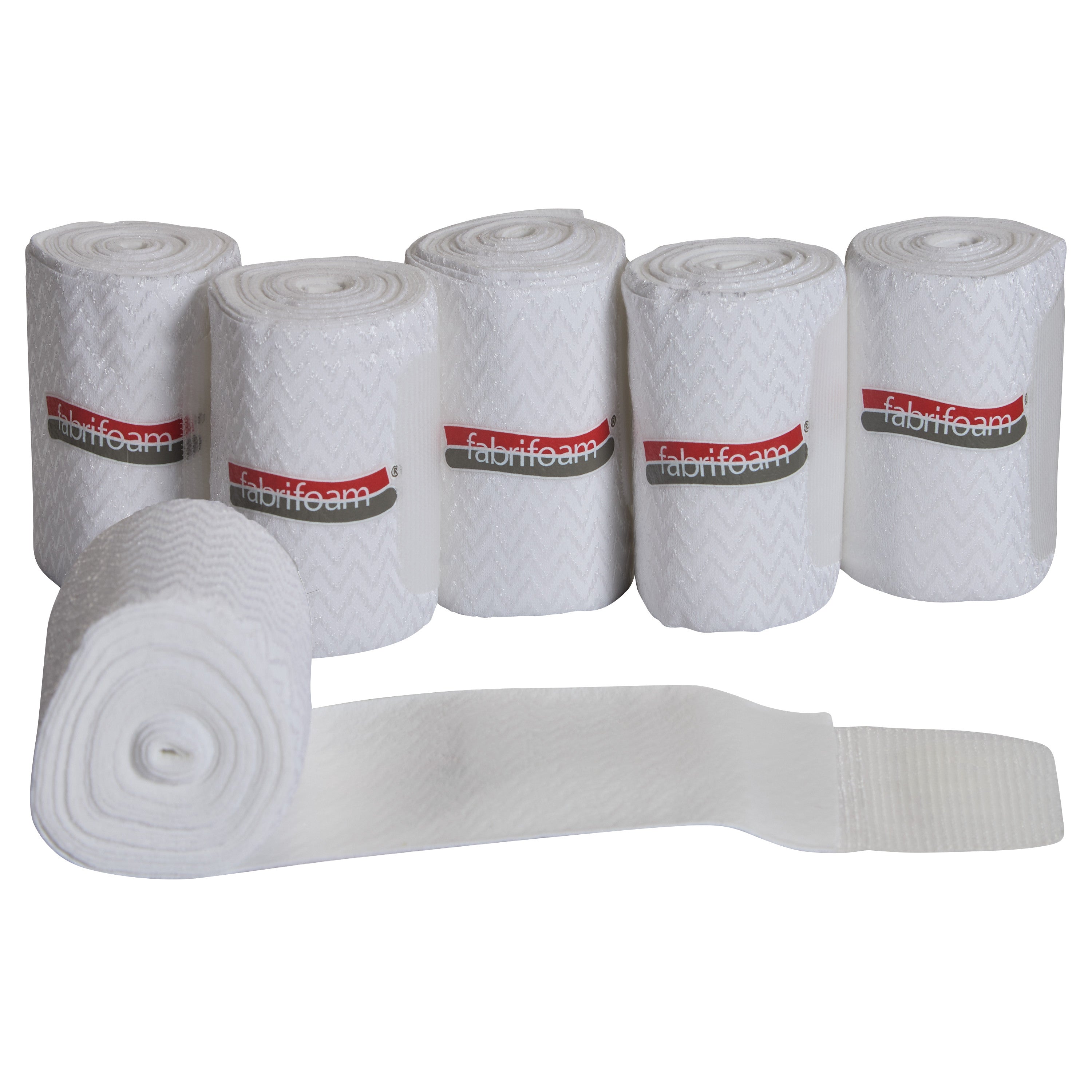 Six rolls of white SuperWrap Compression Wrap with zigzag patterns and Velcro closures are arranged vertically, one unrolled in front.