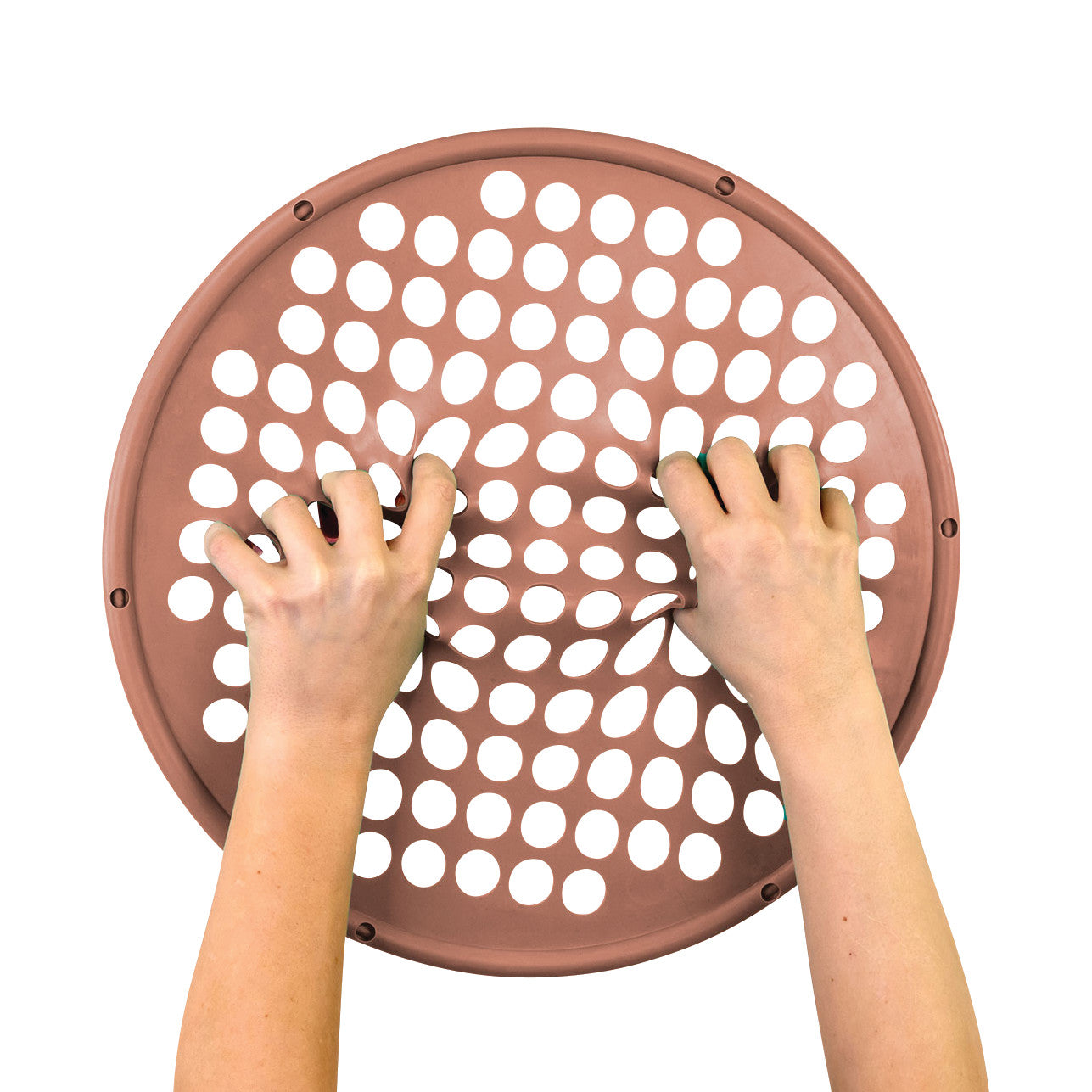 Two hands stretch a brown CanDo Hand Exercise Web with circular cutouts against a white background.