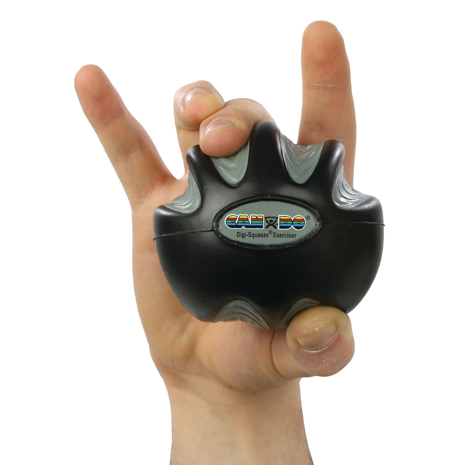 A hand holds the CanDo Digi-Squeeze Hand Exerciser, a black and gray ergonomic tool for strengthening fingers and grip.