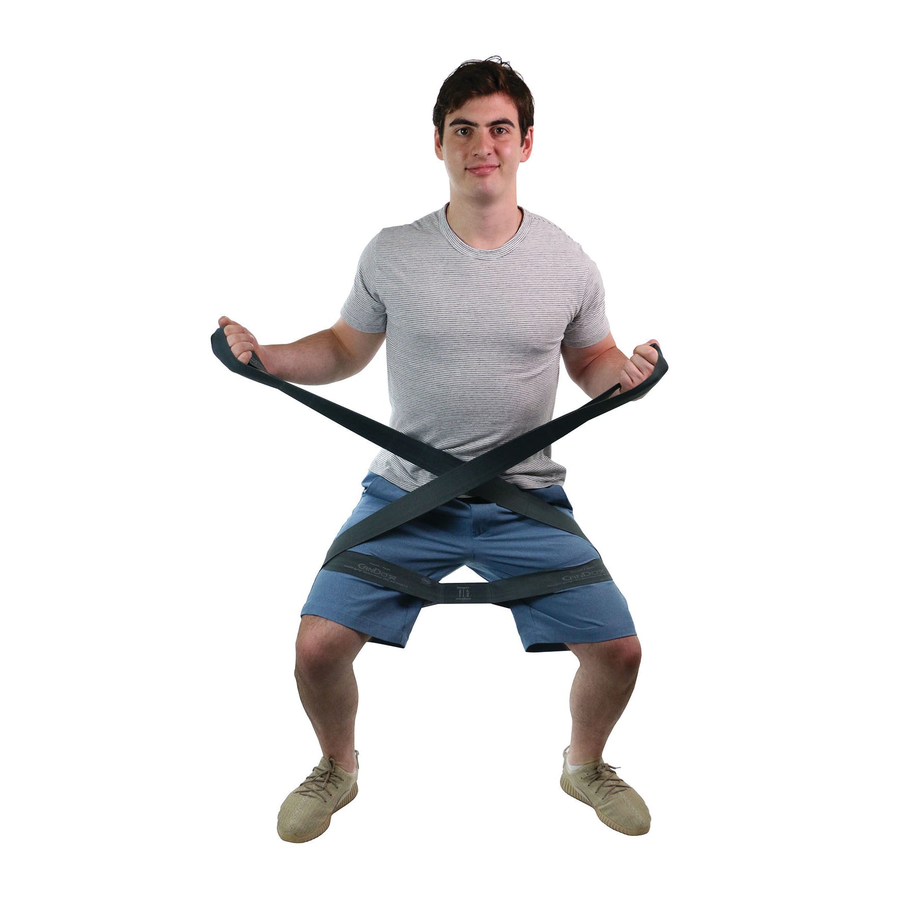 A person uses the CanDo Multi-Grip Exerciser, performing a squat. The strap is wrapped around their arms and legs.