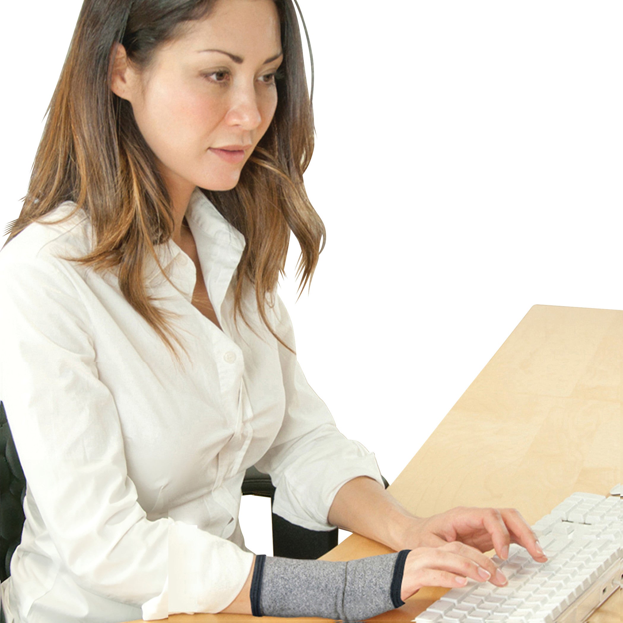 A person types on a keyboard while wearing a Brownmed IMAK Compression Arthritis Wrist Sleeve on their wrist.