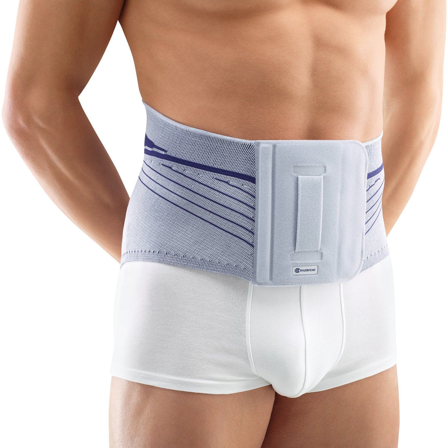 A person wearing a Bauerfeind LumboLoc Back Support over white undergarments. The support is grey with blue accents.