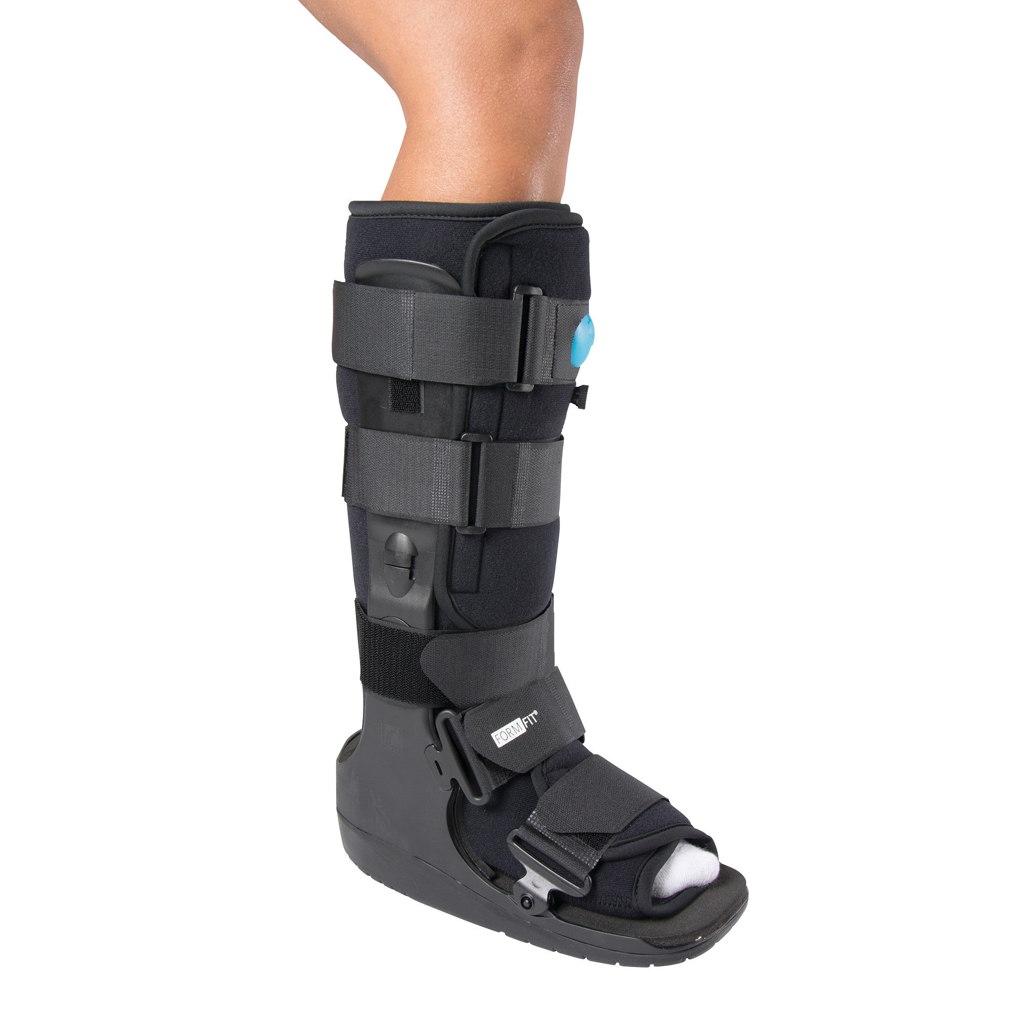 A leg wearing an Ossur Formfit High-Top Air Walker, featuring multiple straps and a black design for foot and ankle support.
