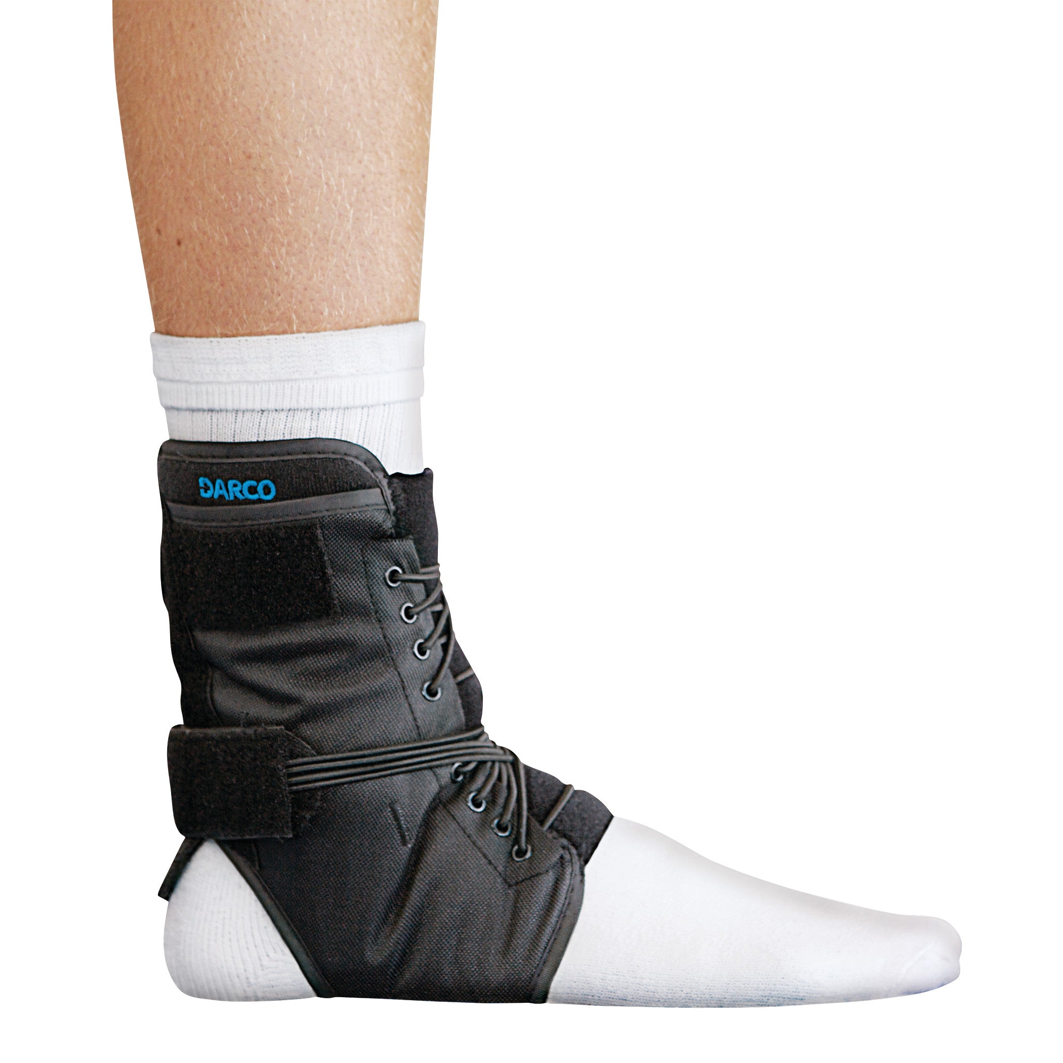 A DARCO Web Ankle Support is worn over a white sock, featuring laces and adjustable straps for stabilization and support.