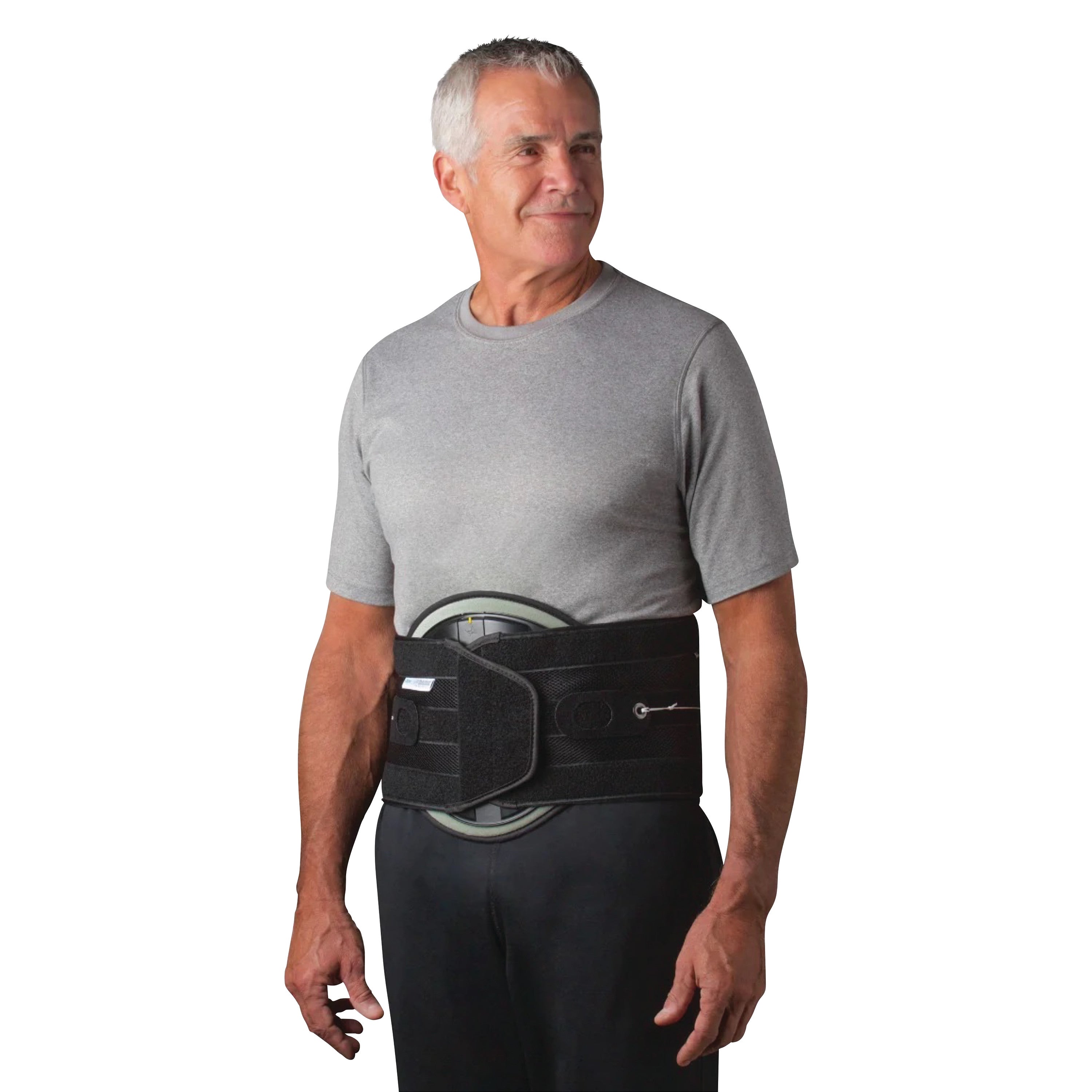 A person wearing a QuickDraw RAP Complete Back Brace over a gray t-shirt, with the brace fastening around the lower back.