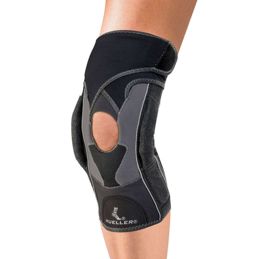 Person wearing a Mueller Hg80 Premium Hinged Knee Brace with open patella and black and gray material design.