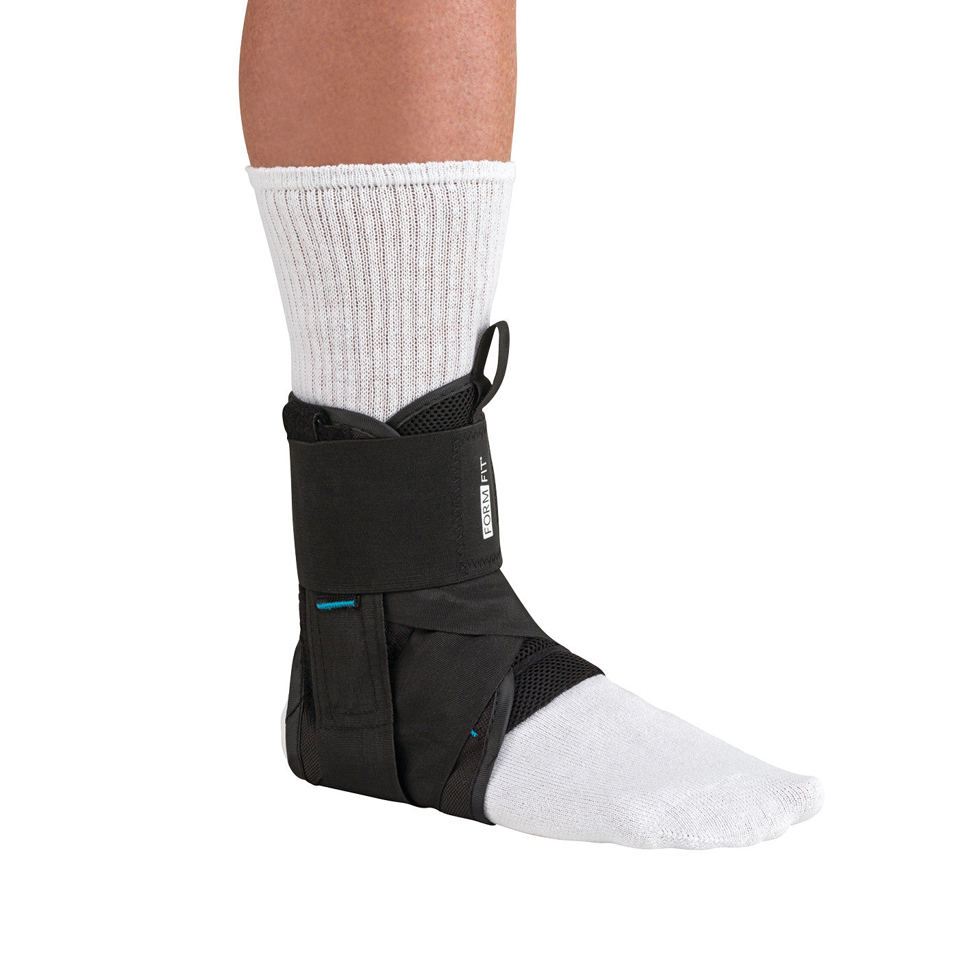 A person wearing the Ossur Formfit Ankle Brace with Speedlace over a white sock, providing support to the ankle.
