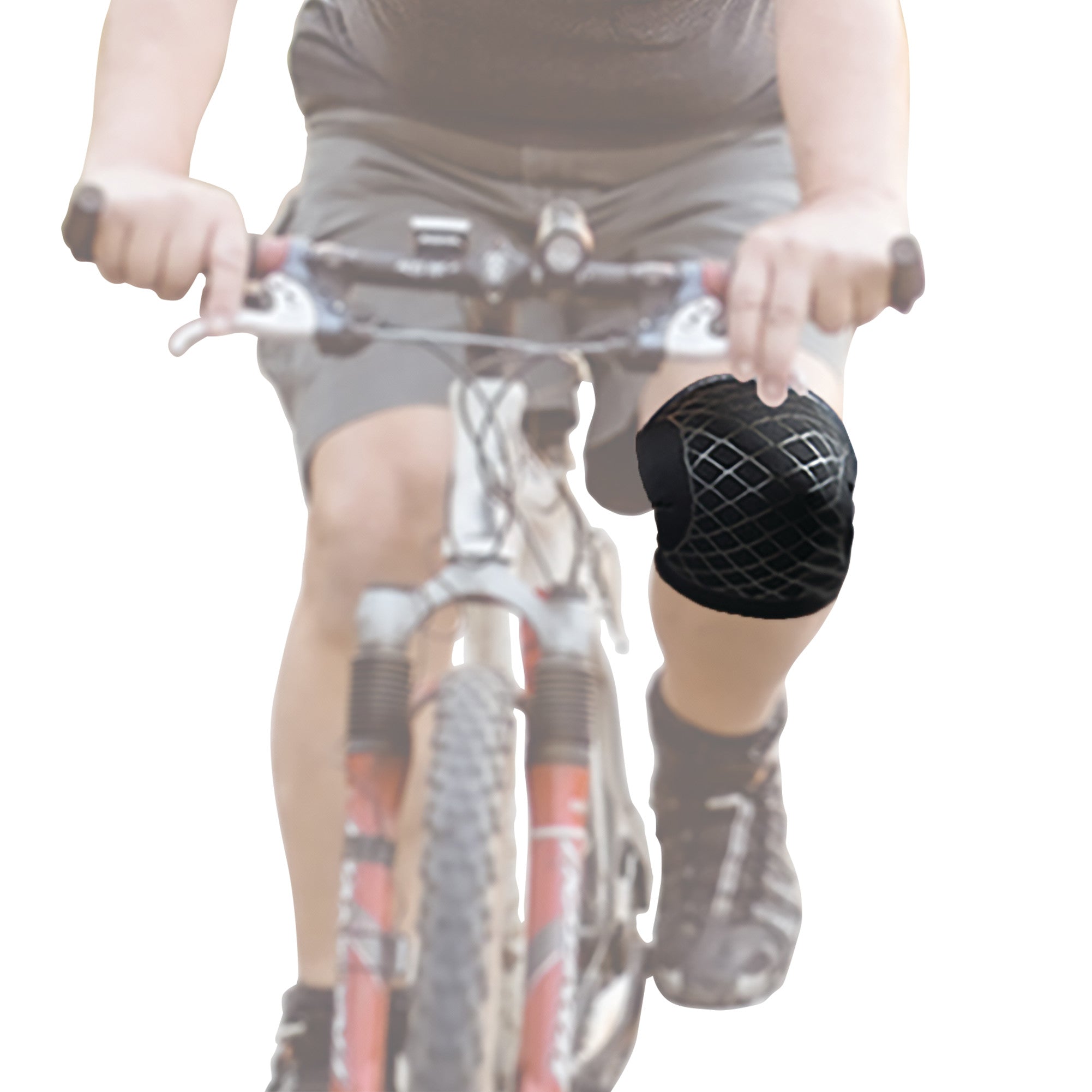 Person cycling with a Brownmed Spark Kinetic Knee Sleeve on their right knee, featuring a black design with a grid pattern.