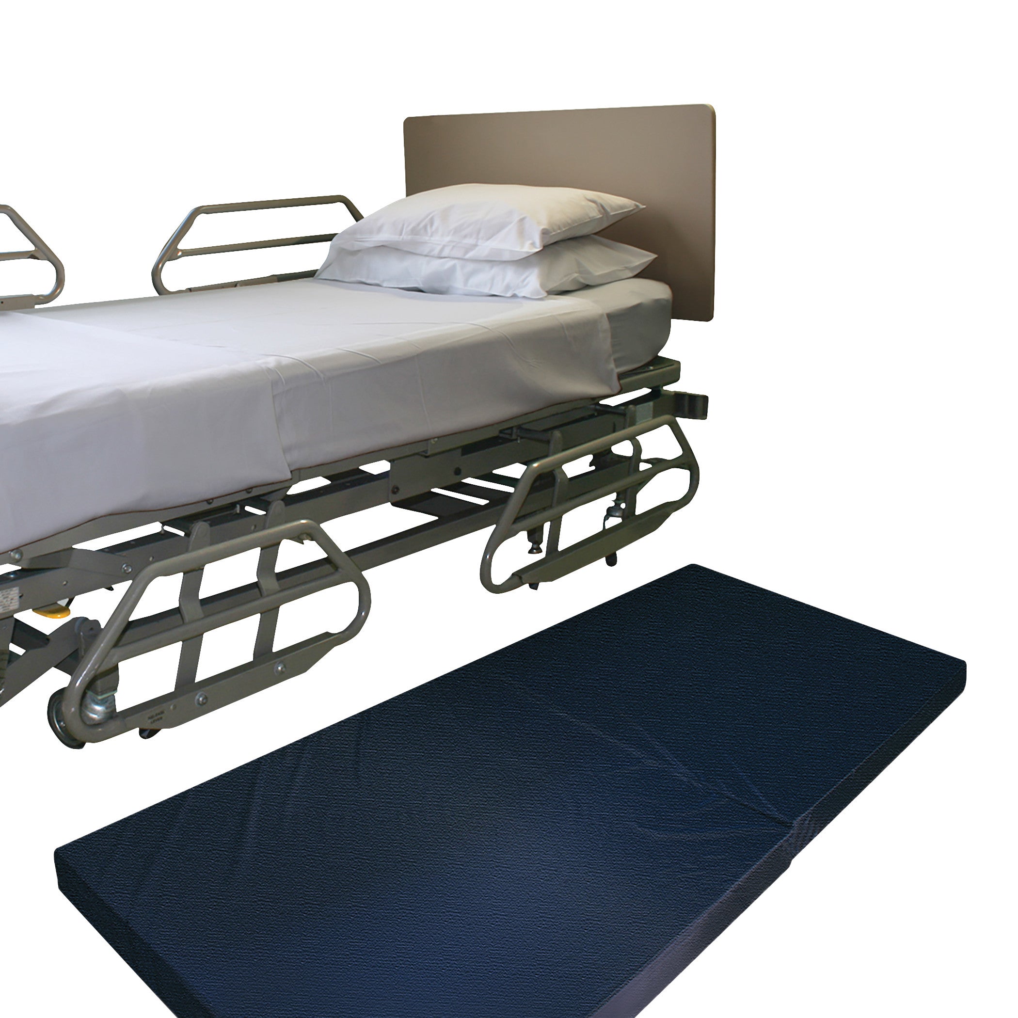 A hospital bed, equipped with side rails, is next to a NYOrtho Bedside Safety Mat, both featuring white bedding and pillows.