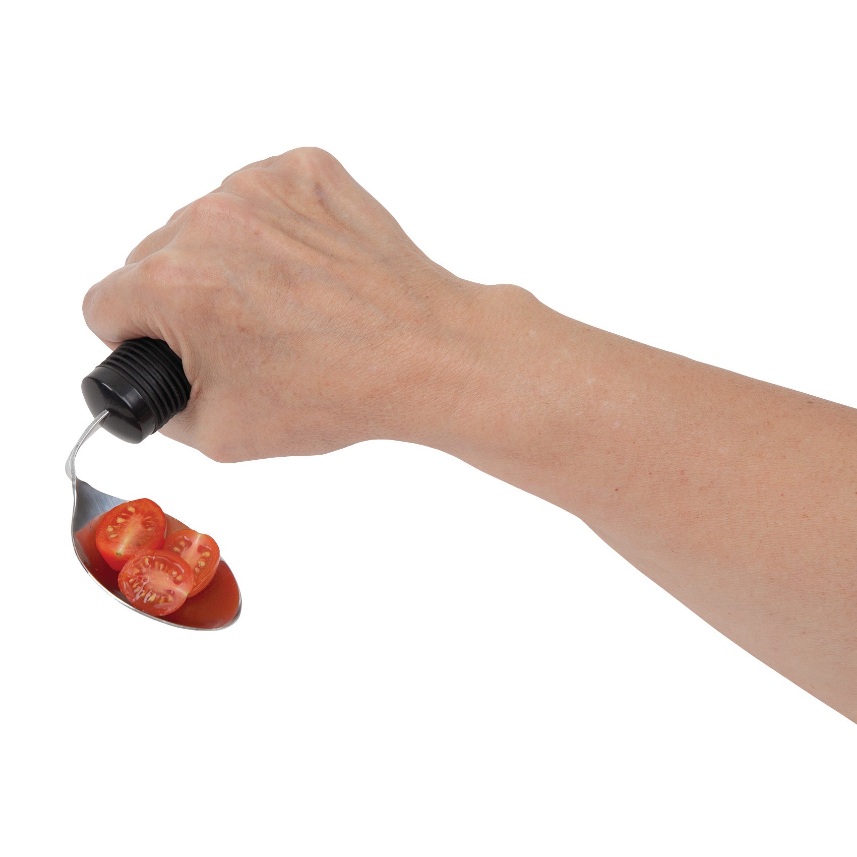 A hand holding a Good Grips Standard Utensil, a spoon, with cherry tomato slices. The utensil has a black ergonomic handle.