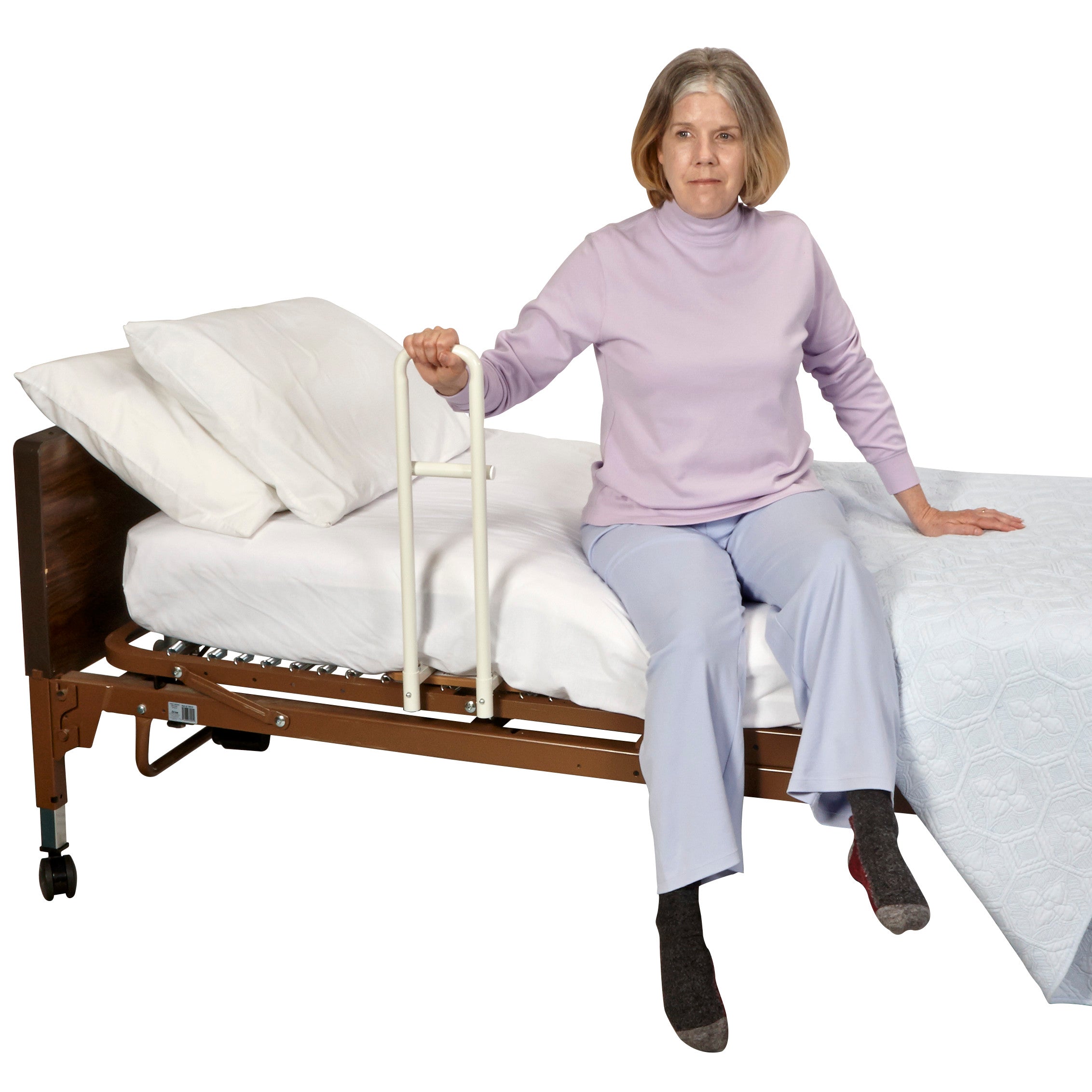 A person sits on a bed holding the Transfer Handle Hospital Model for Pan-Style Beds, designed for stability and support.