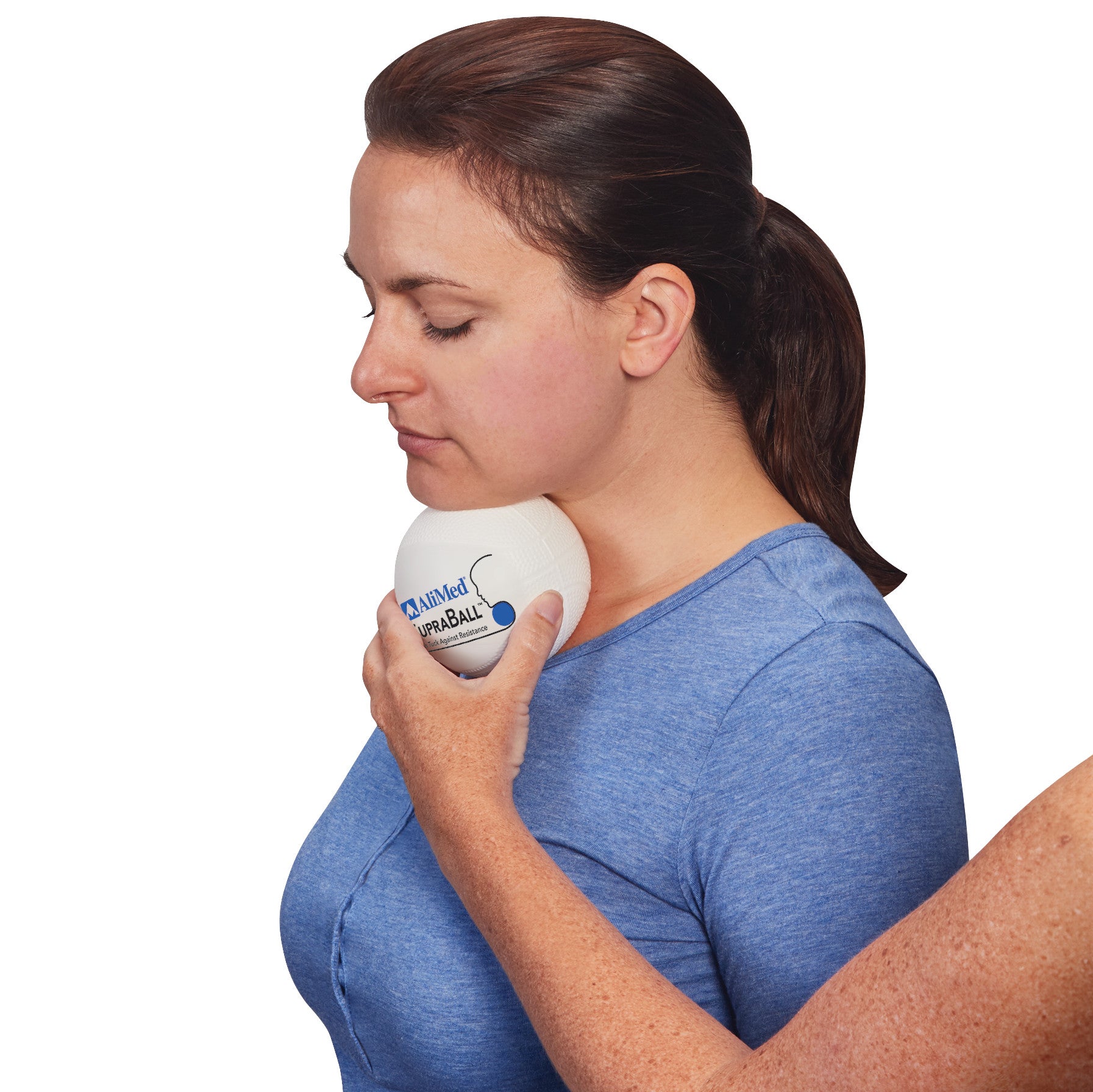 A woman uses an AliMed SupraBall Chin Tuck Against Resistance, pressing it under her chin for an exercise, wearing a blue shirt.