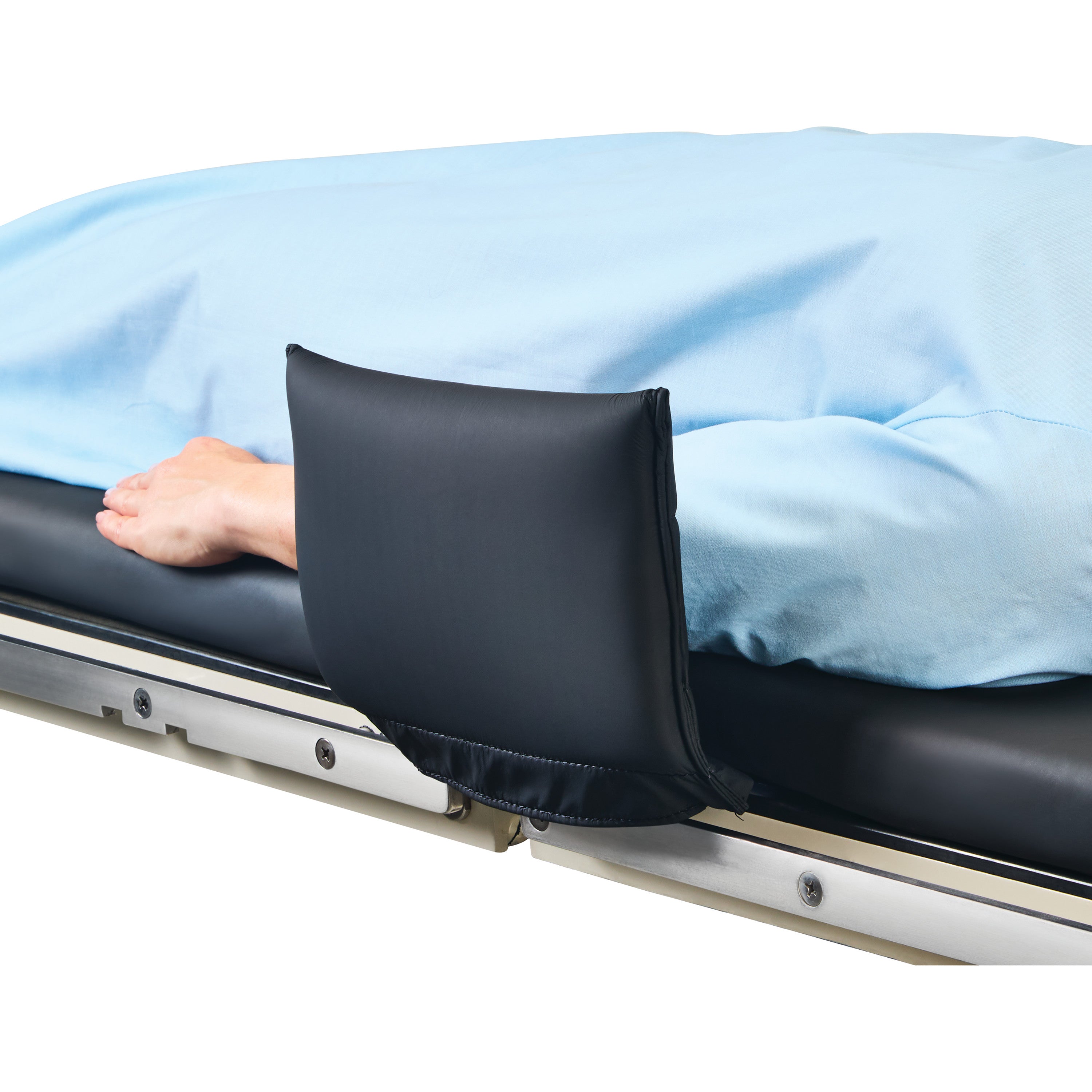 A hand rests on a bed with an "AliMed Padded Toboggan Cover" in black, attached to the bed's side rail, ensuring comfort.