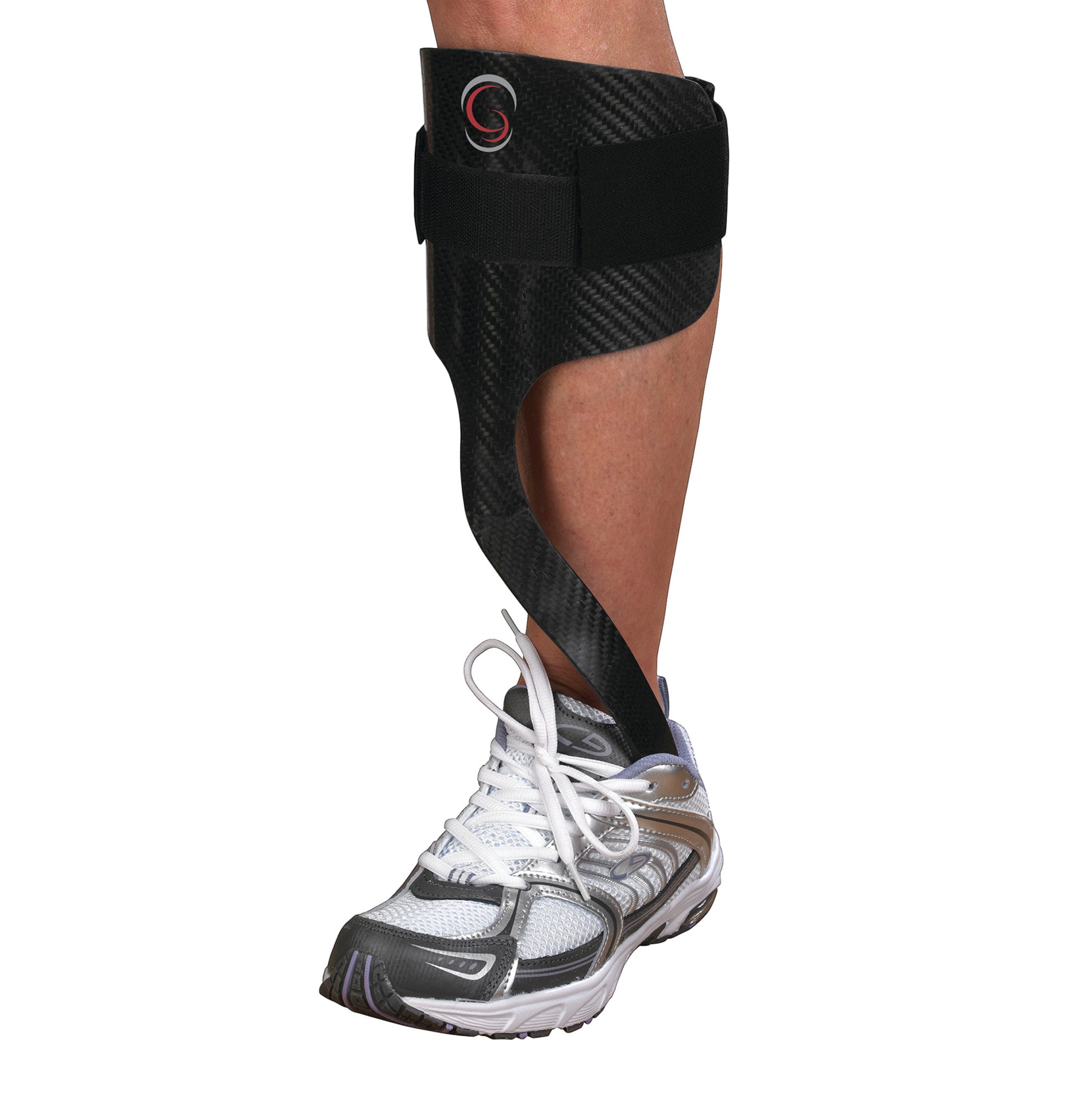 A person's lower leg wearing an Elite AFO Rehabilitator for support, with a black carbon-fiber design and white athletic shoe.