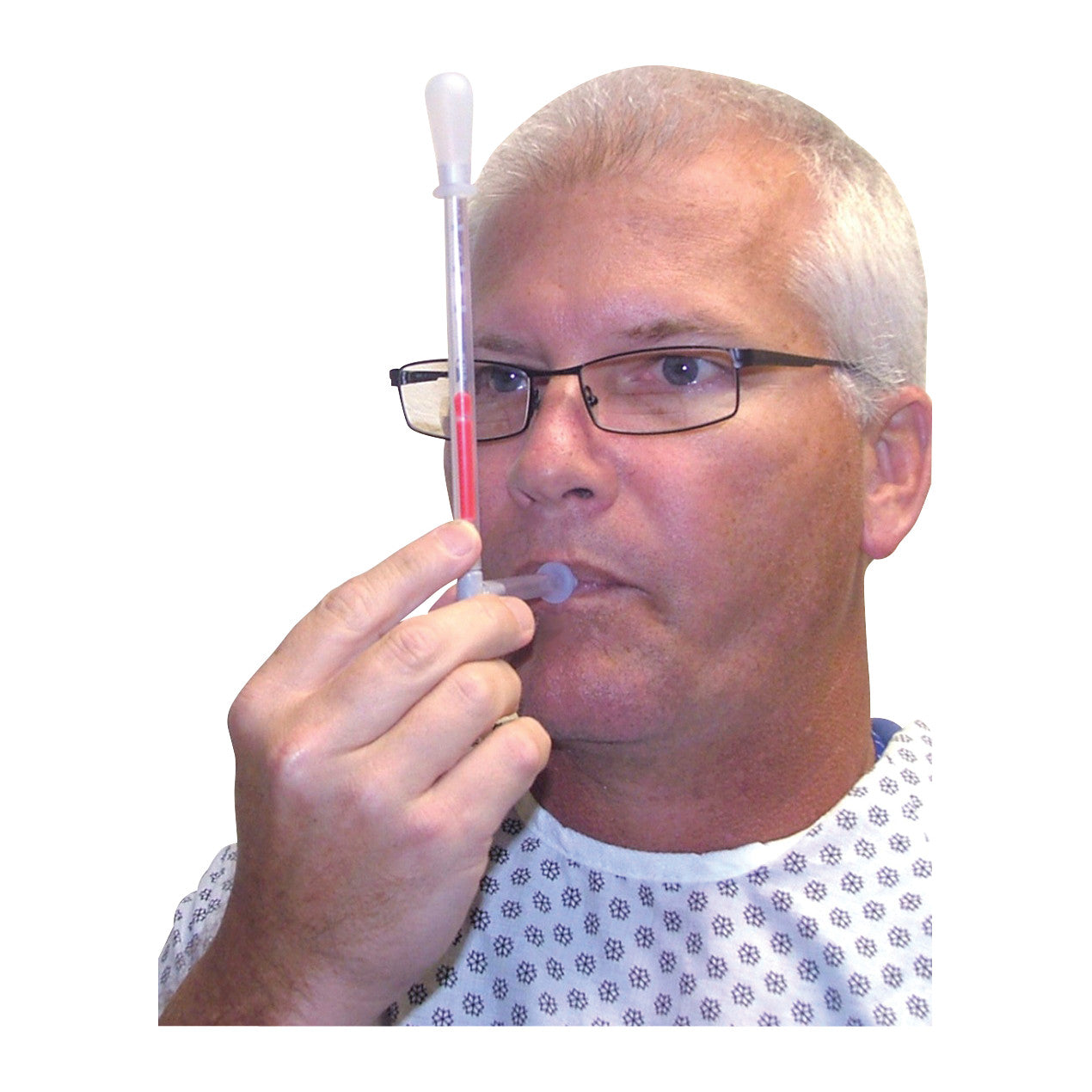 A person uses the TheraSIP TonguePRESS, a medical device with a tube and bulb, wearing glasses and a patterned gown.